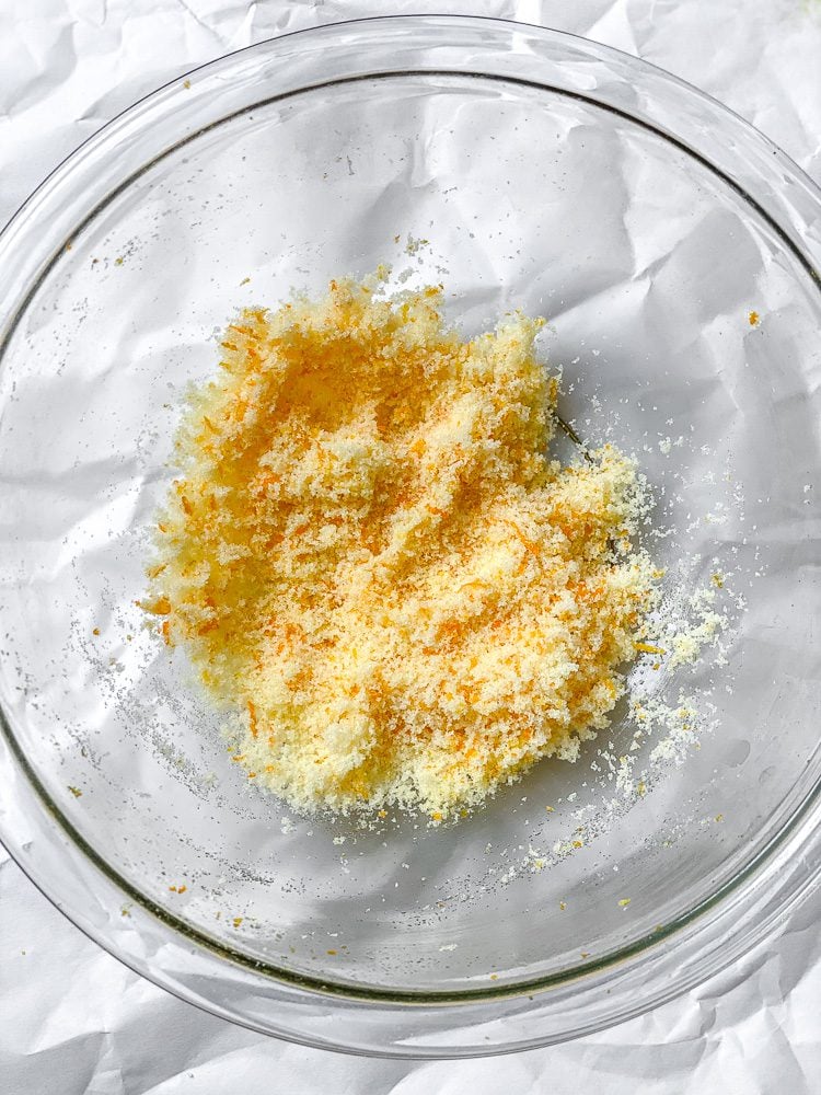 process shot showing zest and sugar in a bowl