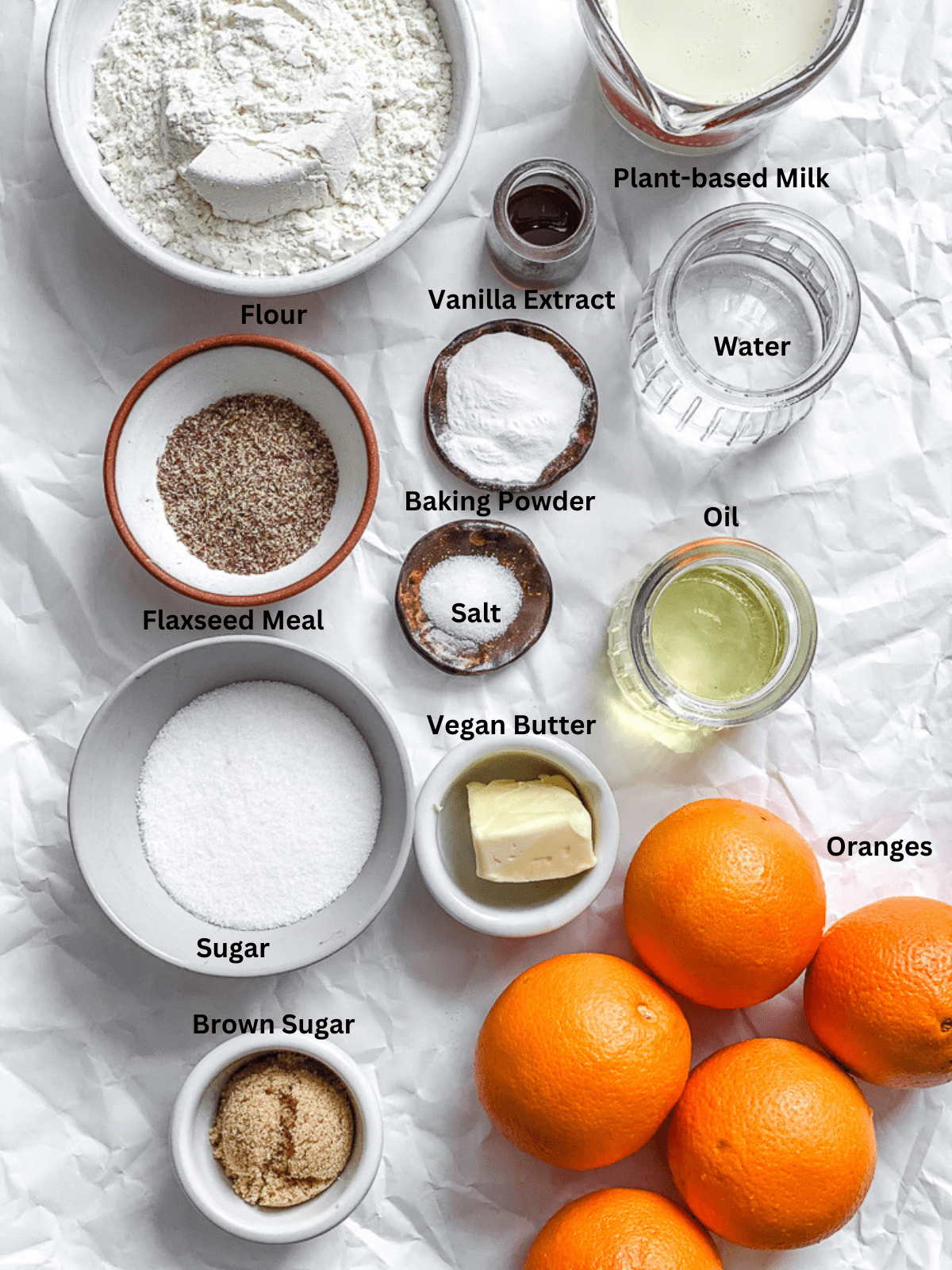 ingredients for Orange Upside Down Cake measured out on a white surface