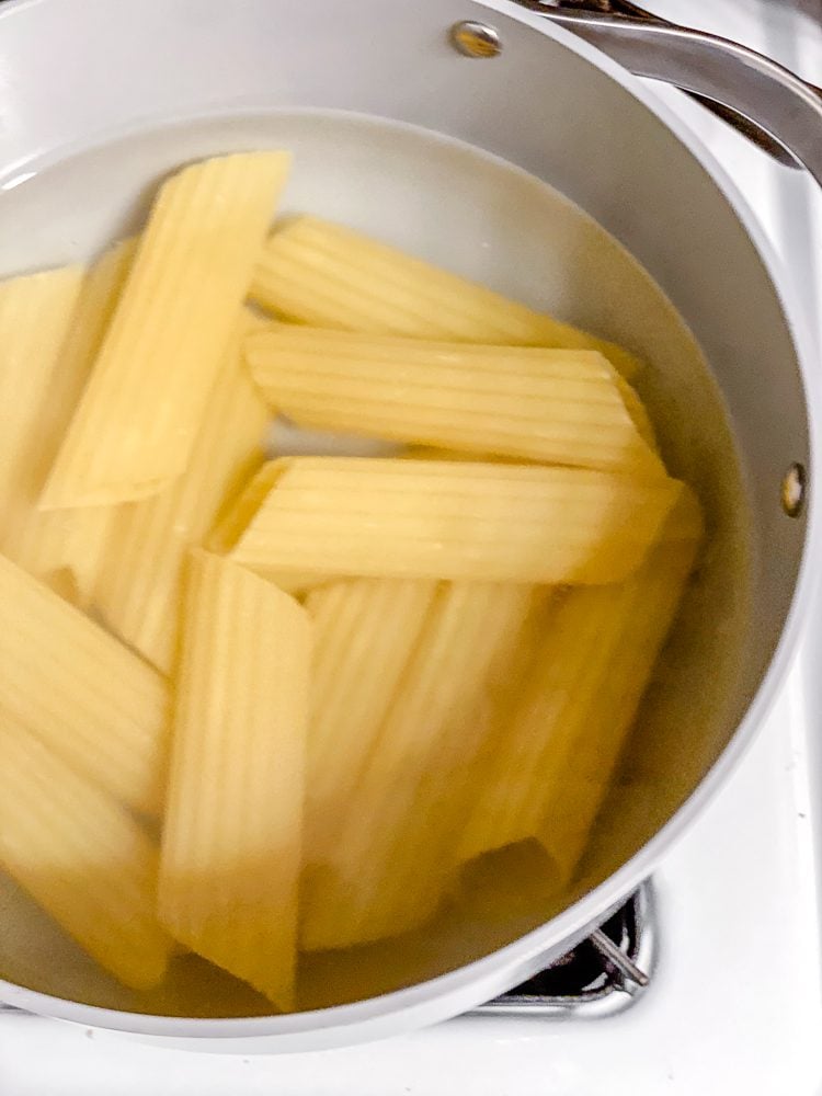 Process shot showing pasta in pot.