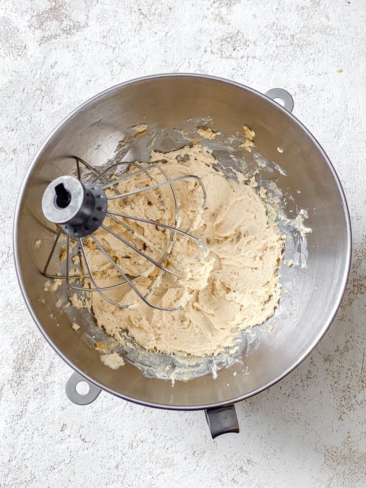 Process shot showing whisking ingredients in a bowl.