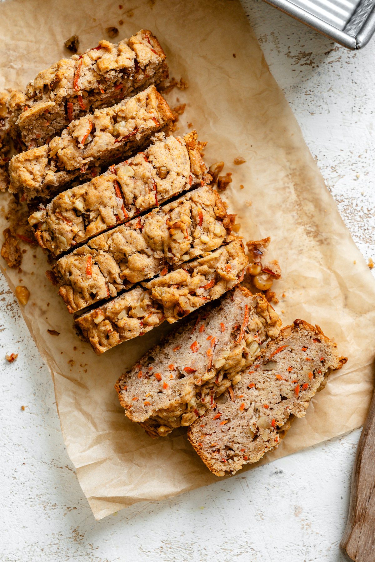 Completed sliced Vegan Carrot Cake Loaf in loaf pan.