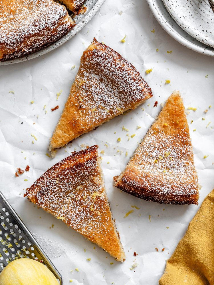 Completed Lemon Olive Oil Cake (Vegan) slices on white surface.