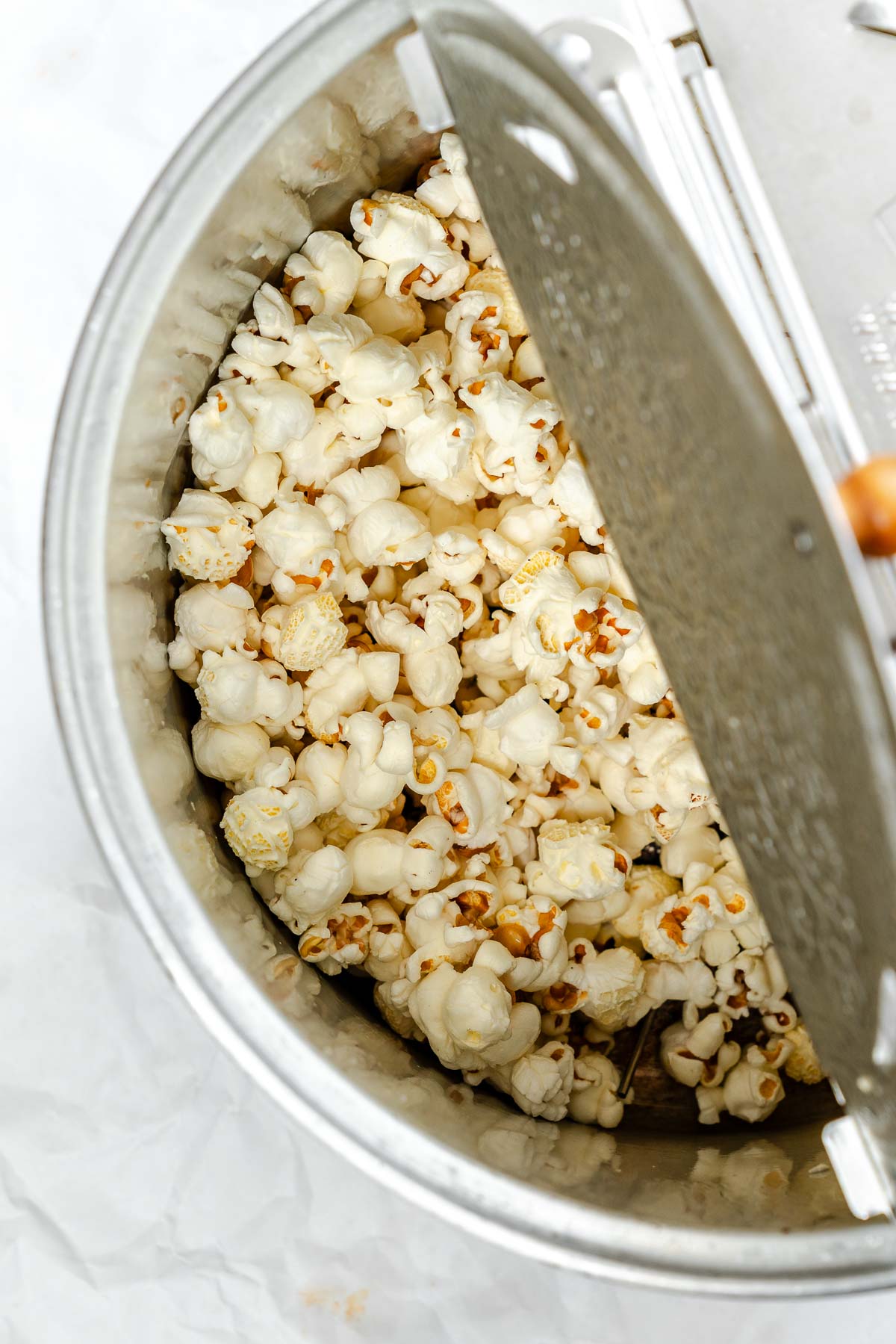 Process shot showing popcorn in pot.