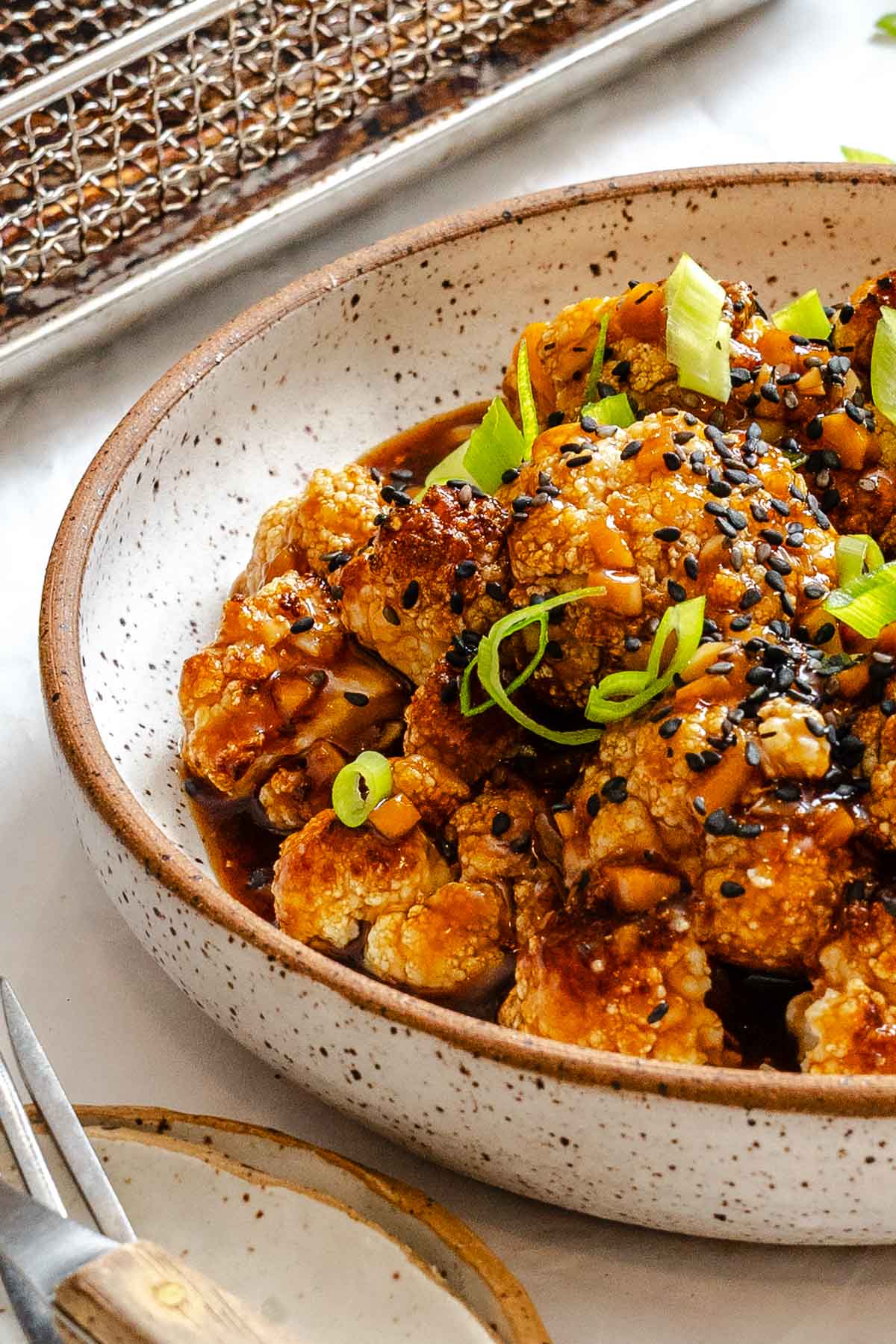 Completed Sticky Sesame Cauliflower (Air-Fried) in a bowl.