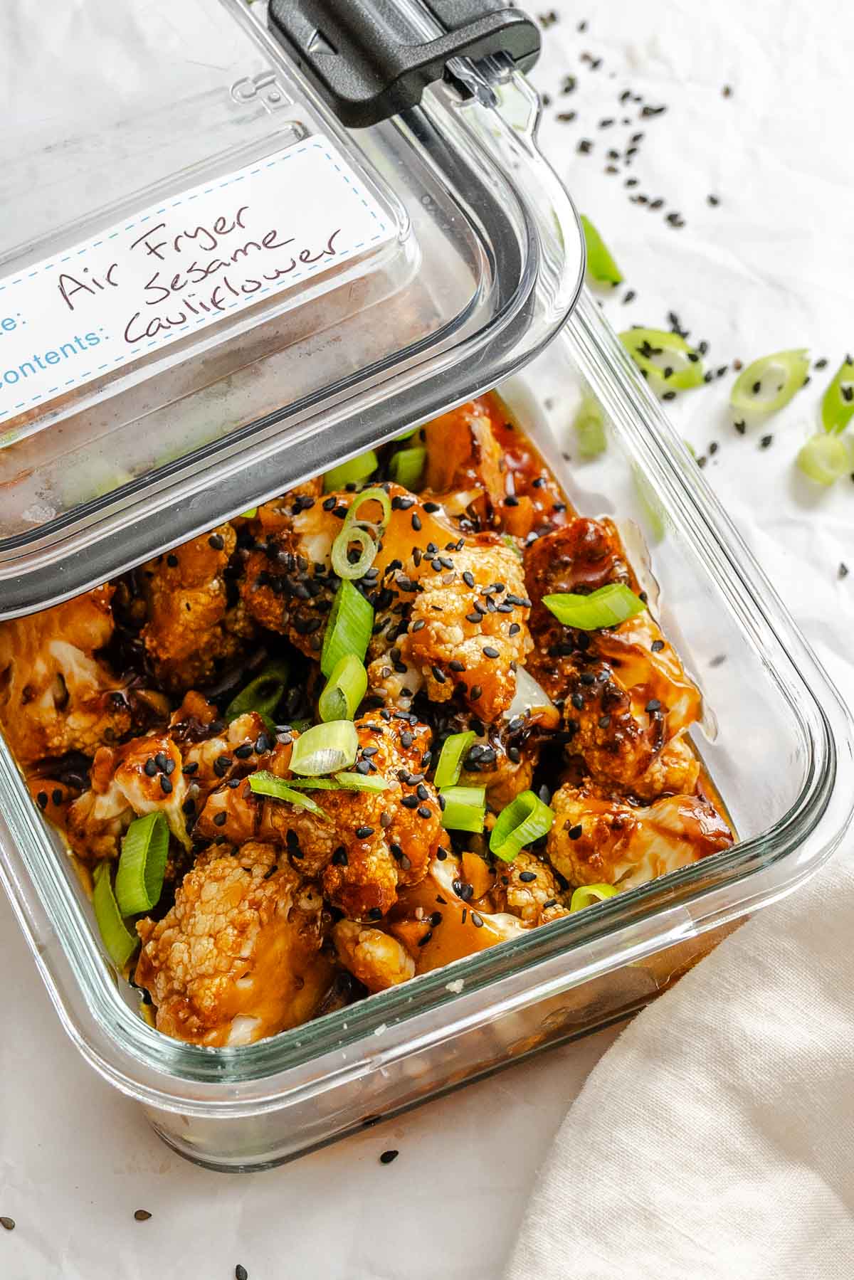 Completed Sticky Sesame Cauliflower (Air-Fried) in a storage container.