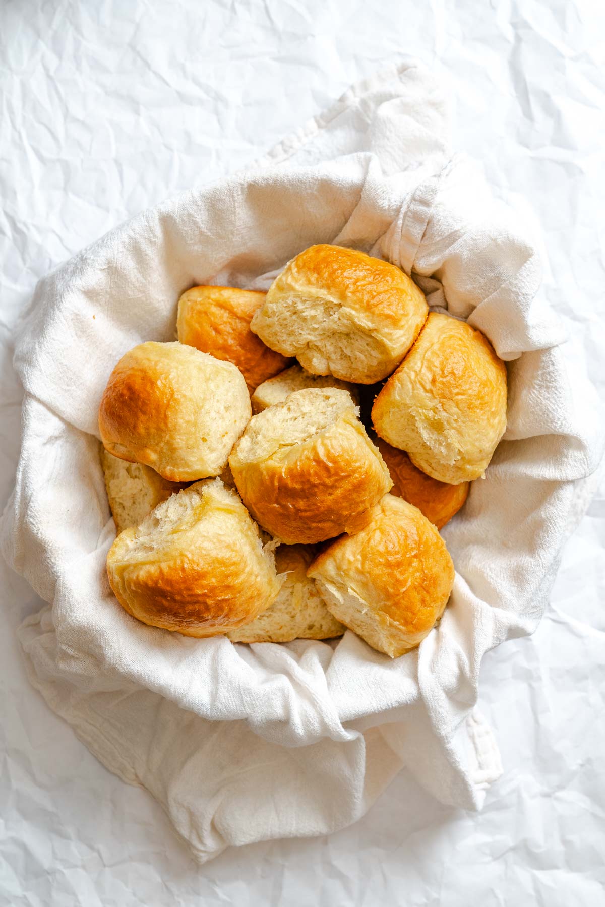 Completed Fluffy Vegan Dinner Rolls in basket.