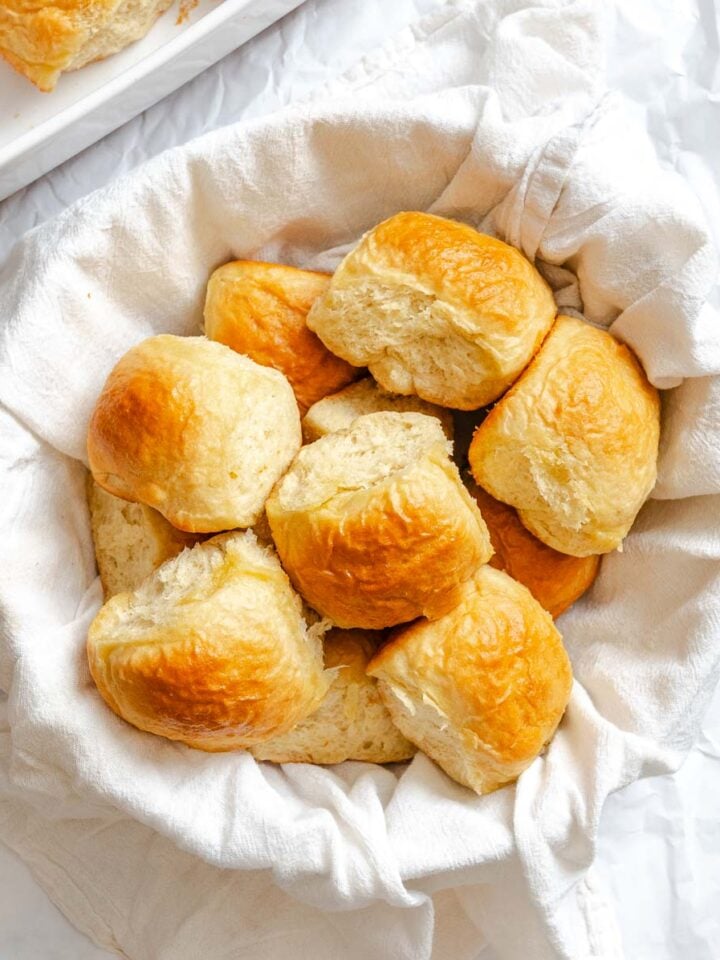 Completed Fluffy Vegan Dinner Rolls in basket.