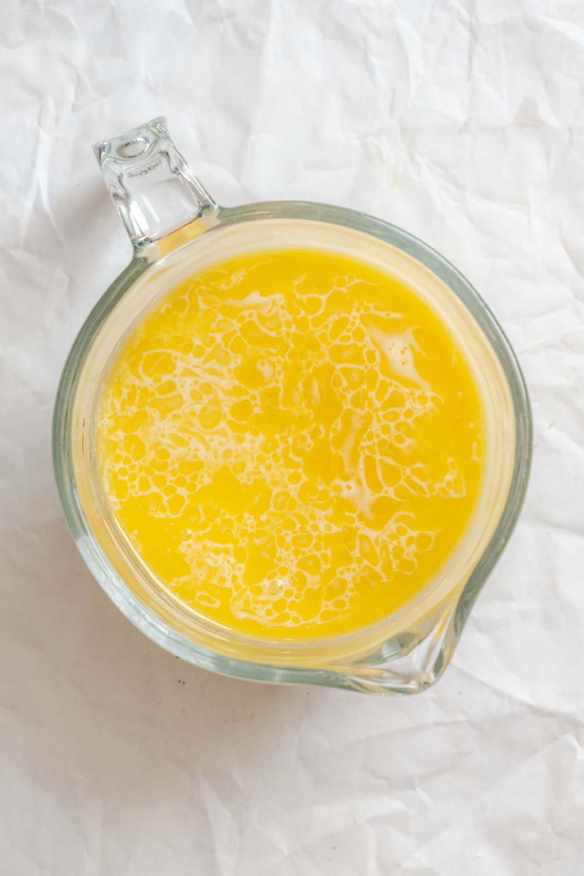 Process shot showing vegan butter mixture in mixer container.