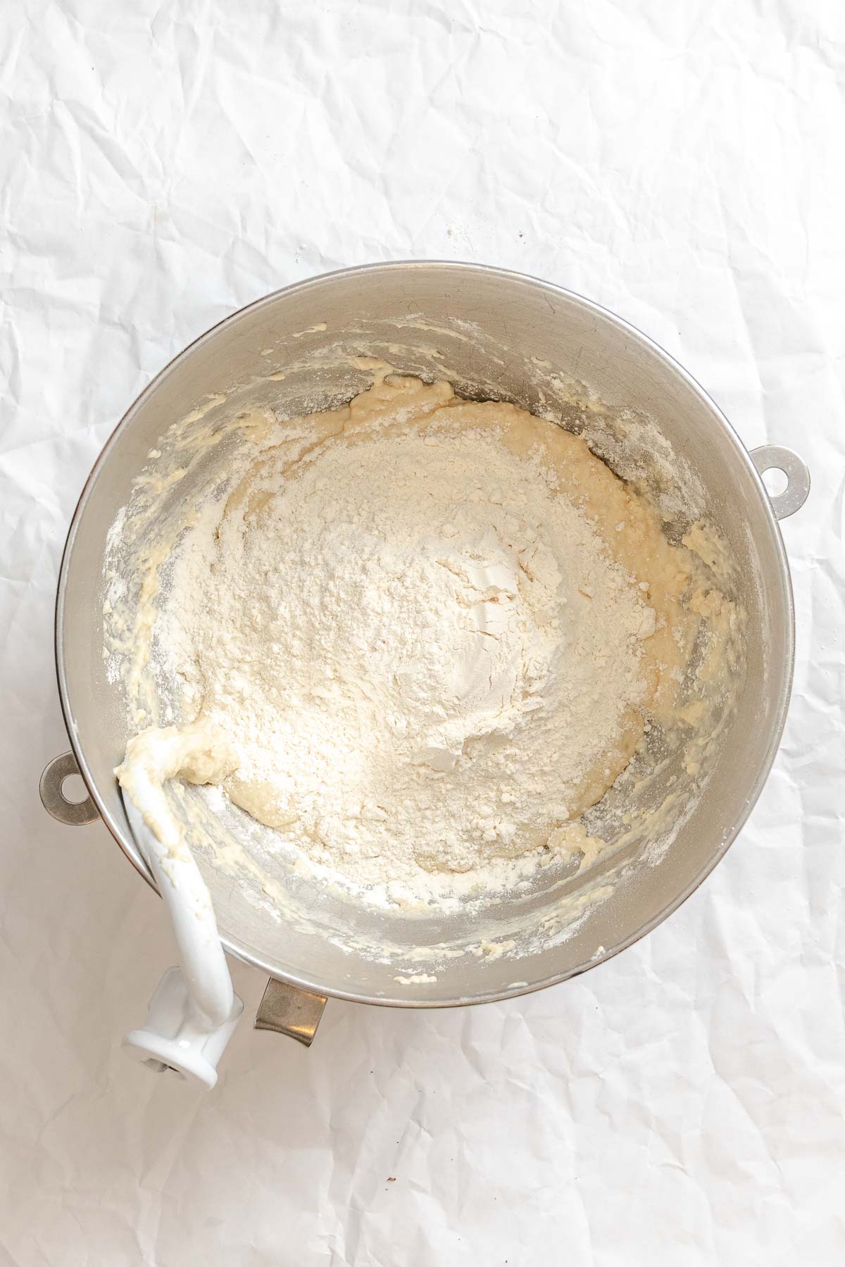 Process shot showing mixing ingredients in a bowl.