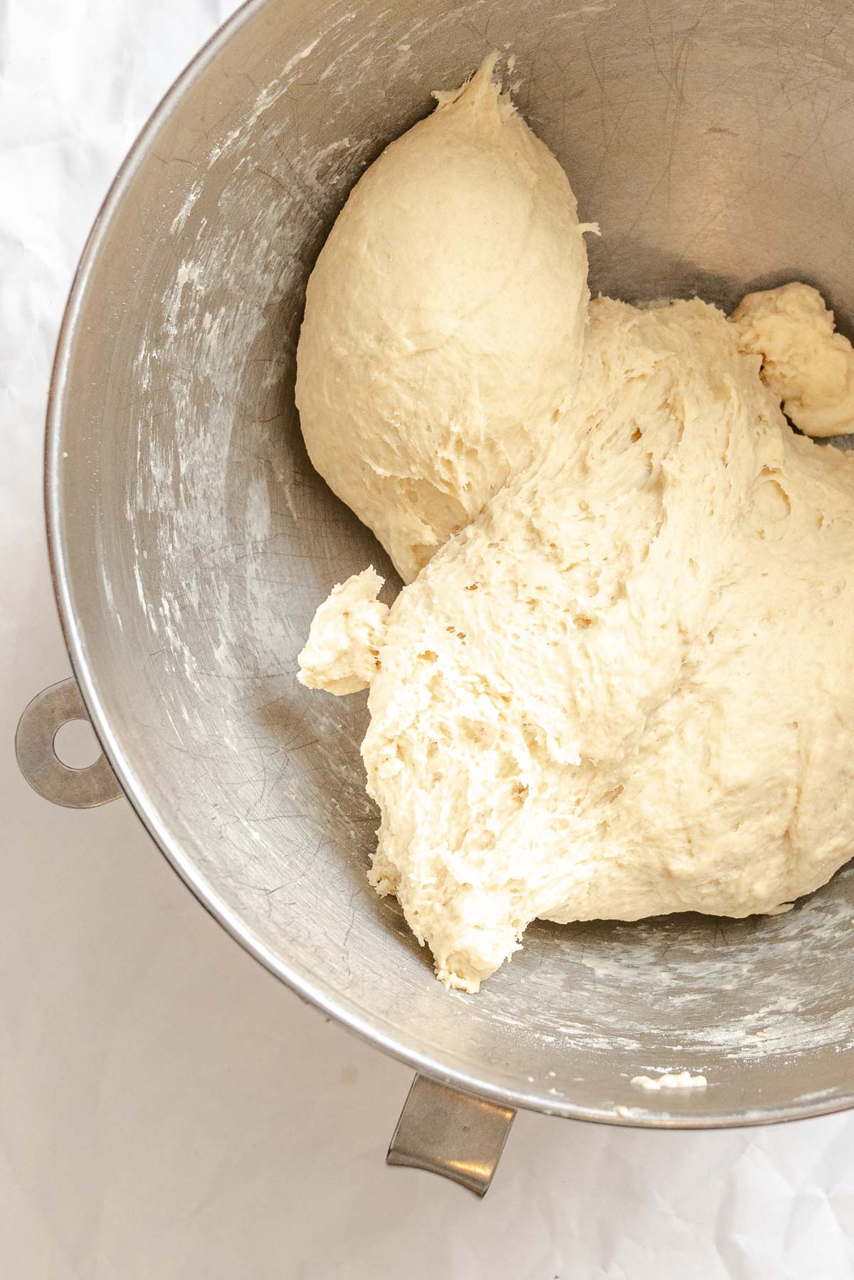 Process shot showing dough formation in bowl.