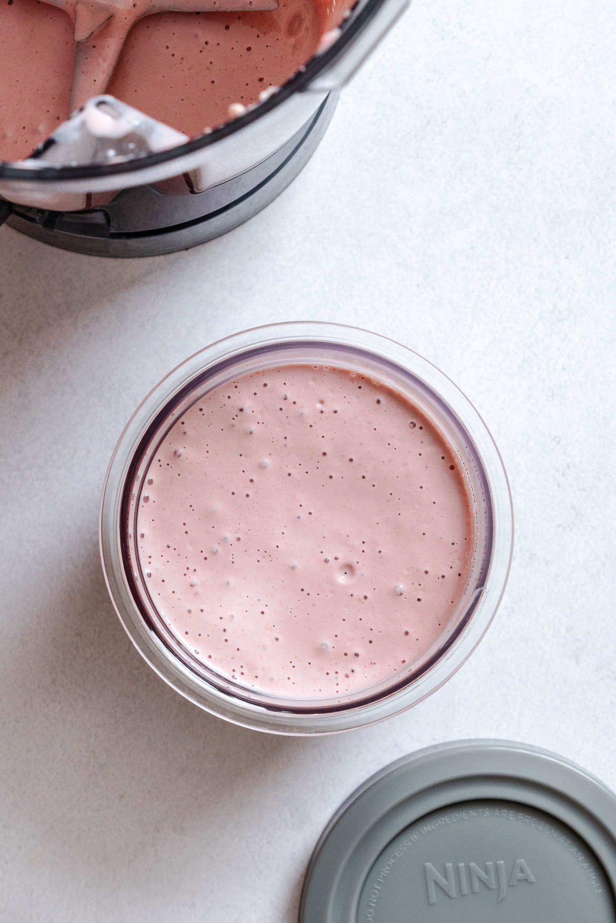 Process shot showing blended ingredients in the pint container.
