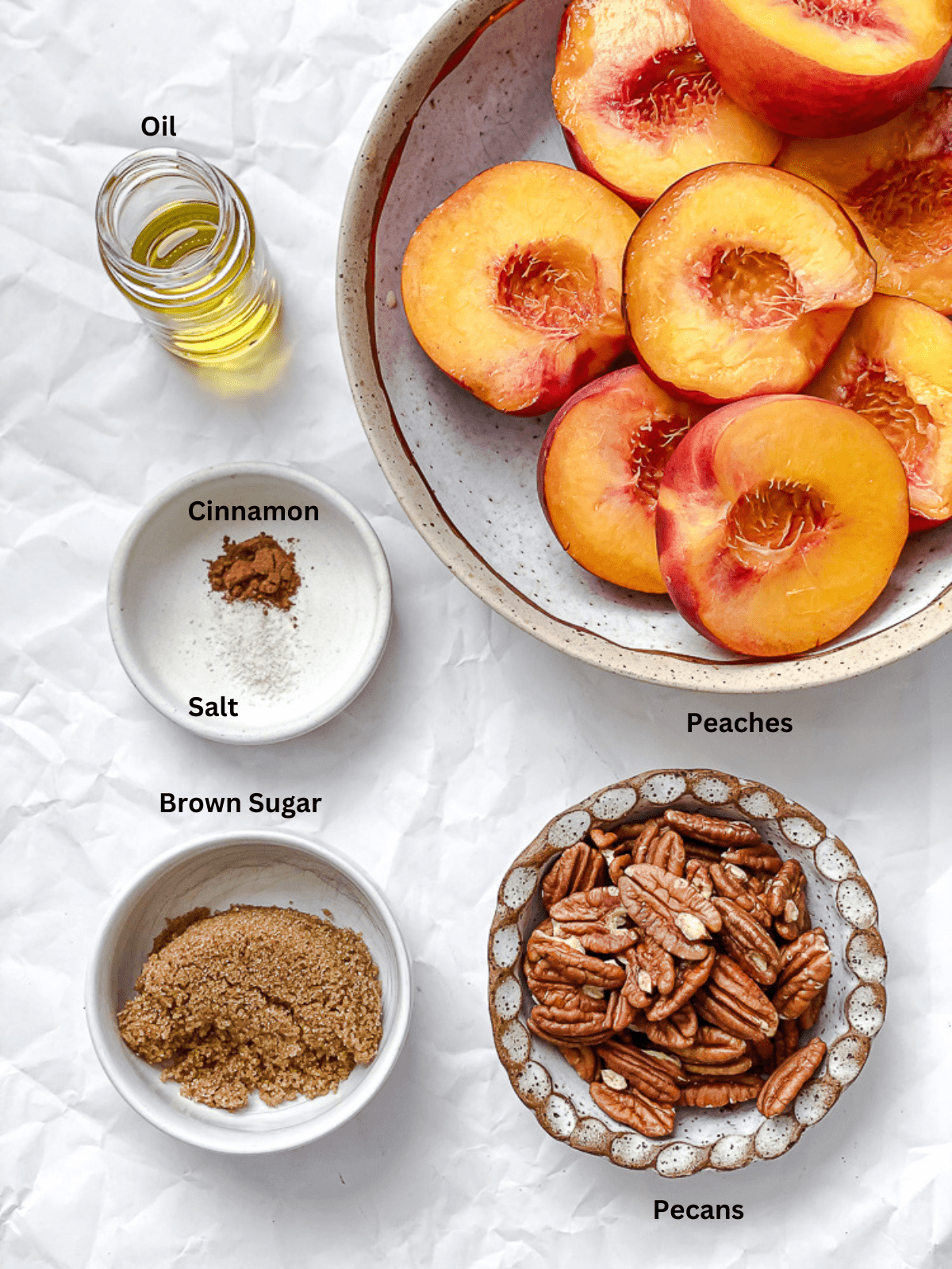 Ingredients for Easy Grilled Peaches measured out on a white surface.