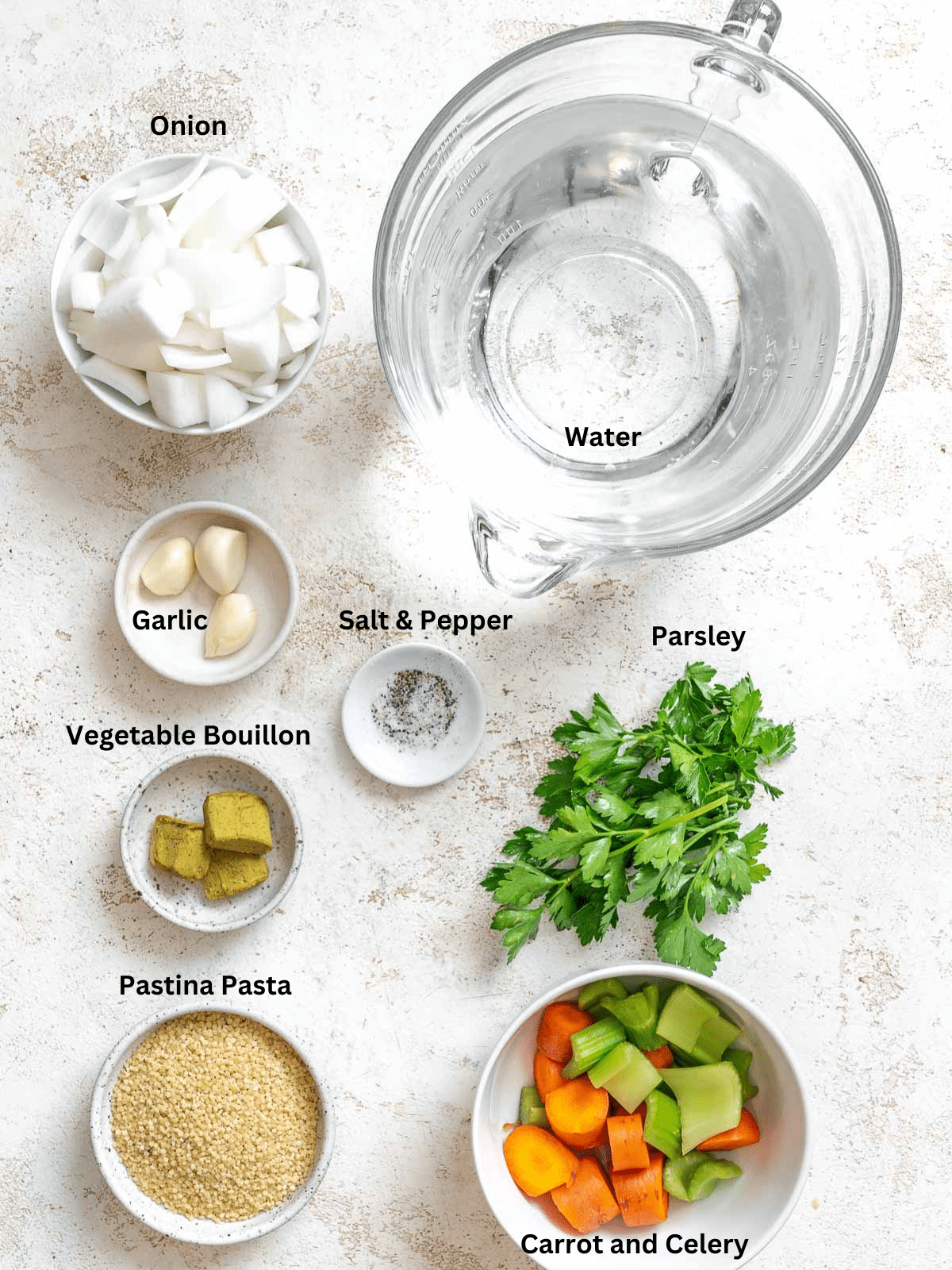 Ingredients for Easy Pastina measured out on a white surface,