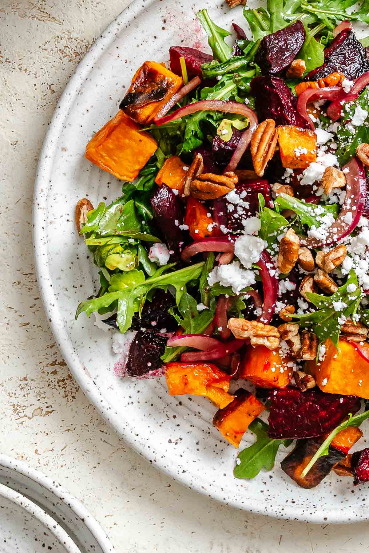 Completed Roasted Beetroot Sweet Potato Salad on a plate.