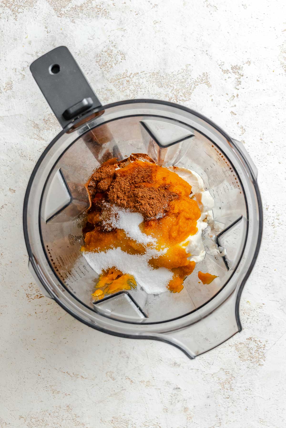 Process shot showing ingredients added to blender.