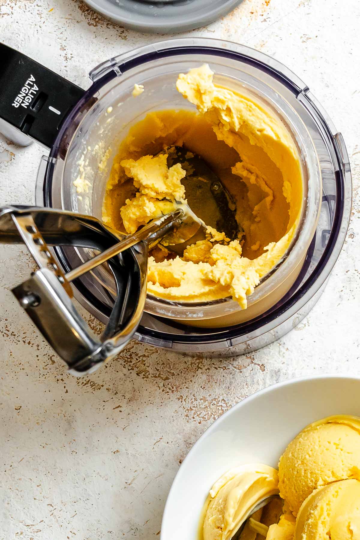 Process shot showing mixing ingredients in a bowl.