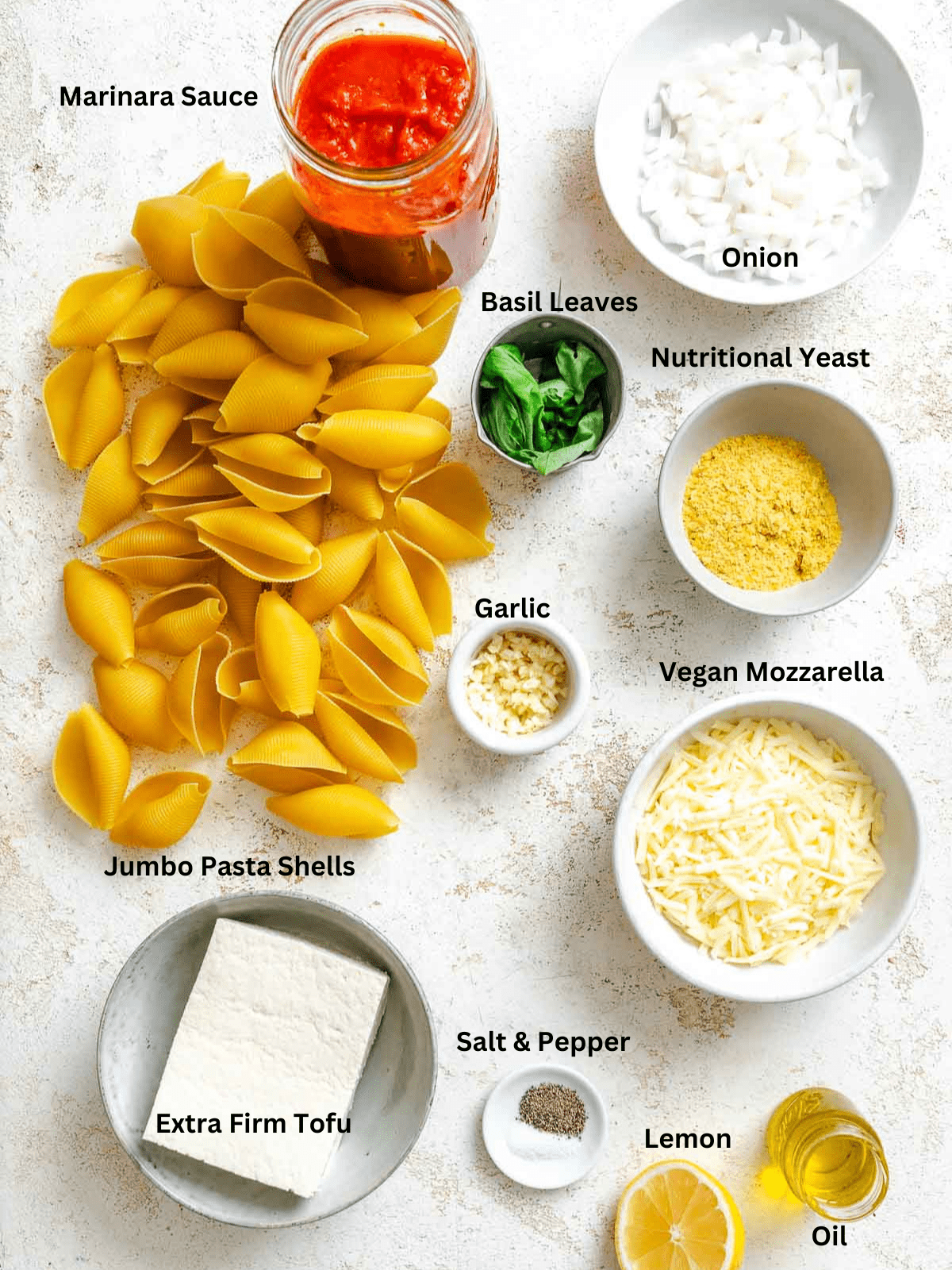 Ingredients for Vegan Stuffed Shells measured out on a white surface.