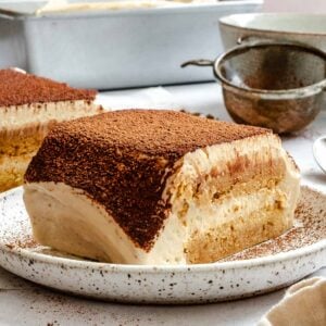Completed Easy Vegan Tiramisu on a white surface.