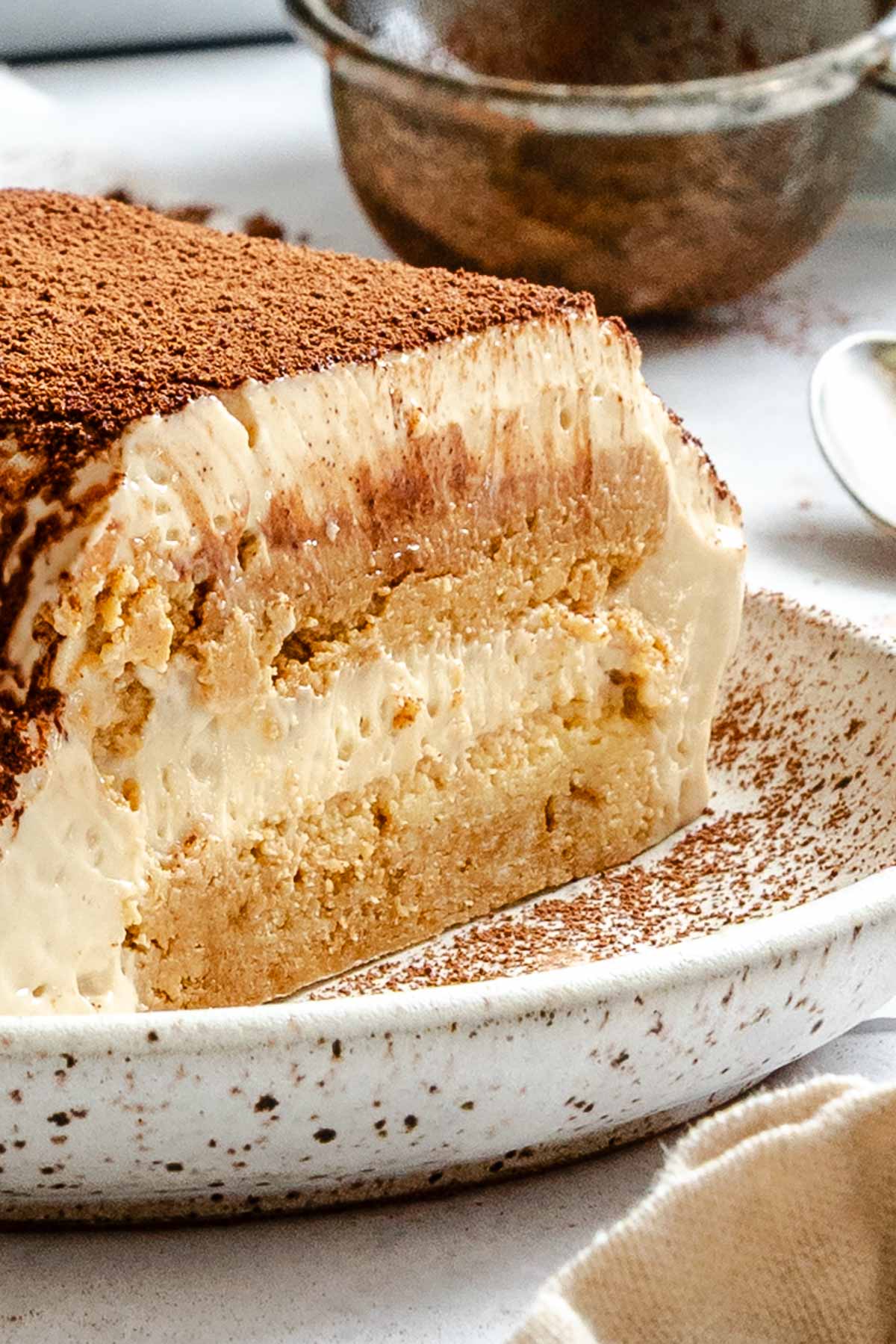 Completed Easy Vegan Tiramisu on a white surface.