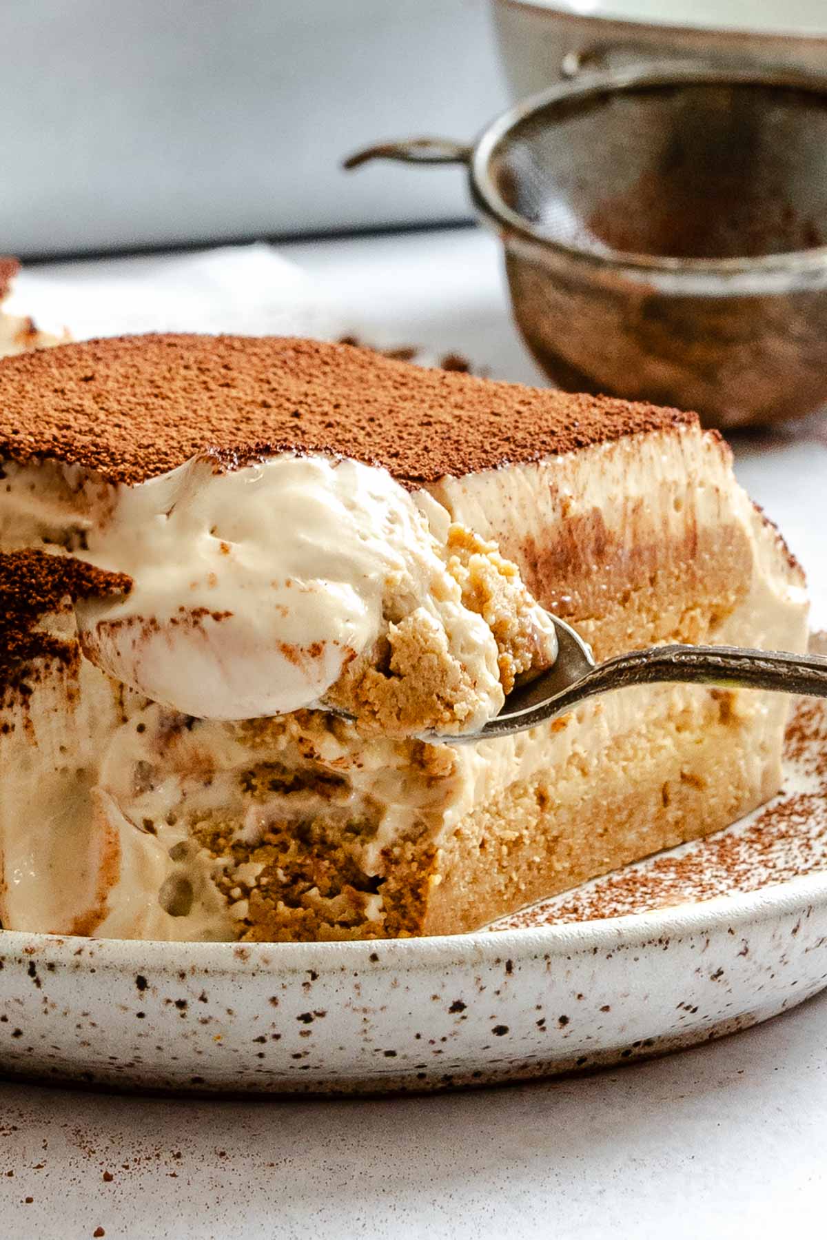 Completed Easy Vegan Tiramisu on a white surface.