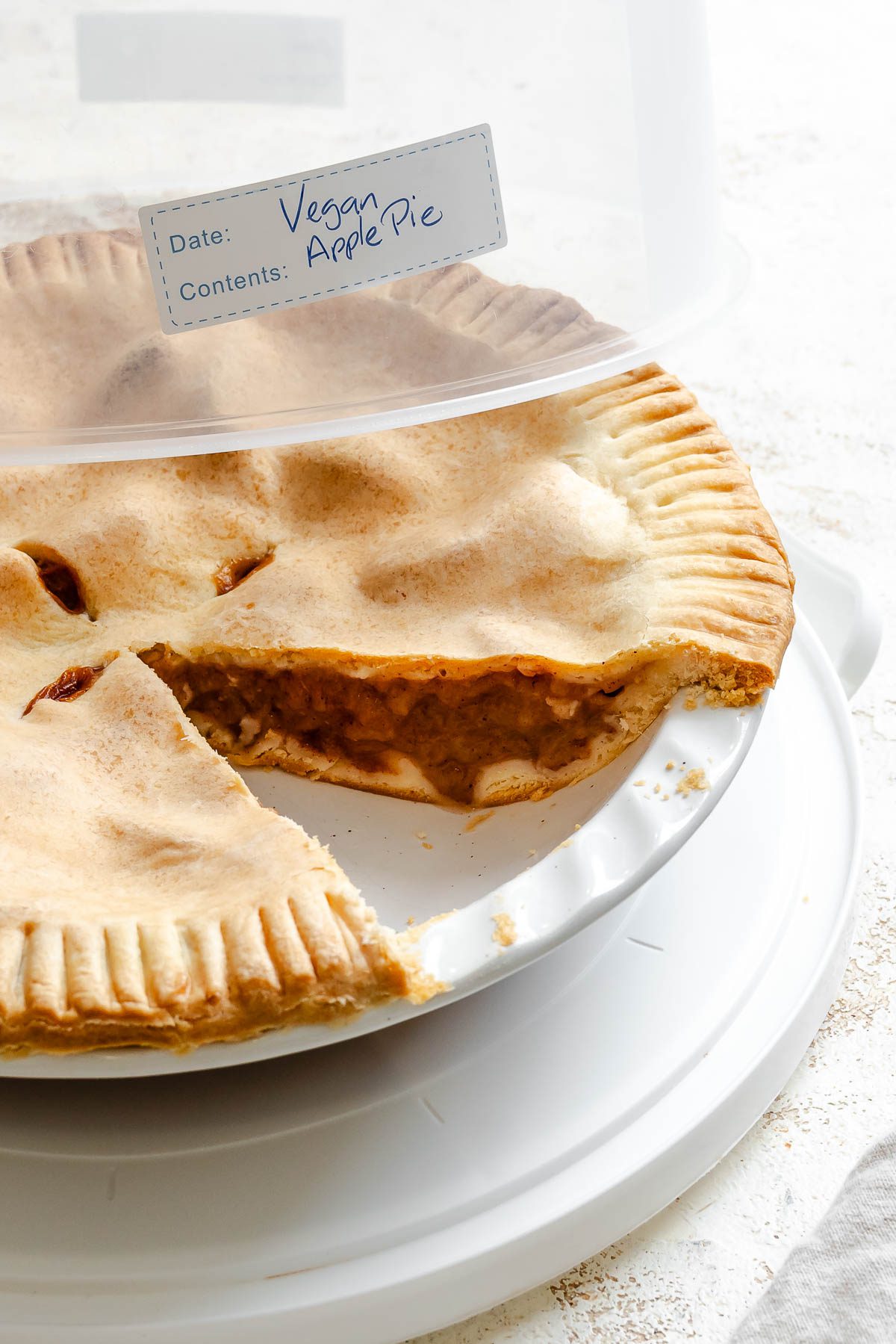 Completed Easy Vegan Apple Pie in a storage container.