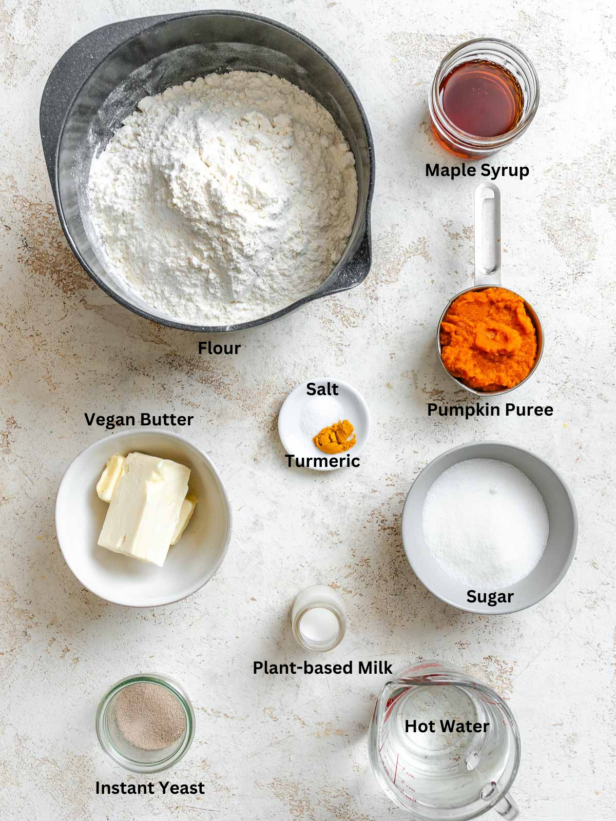 Ingredients for Vegan Challah on a white surface measured out.