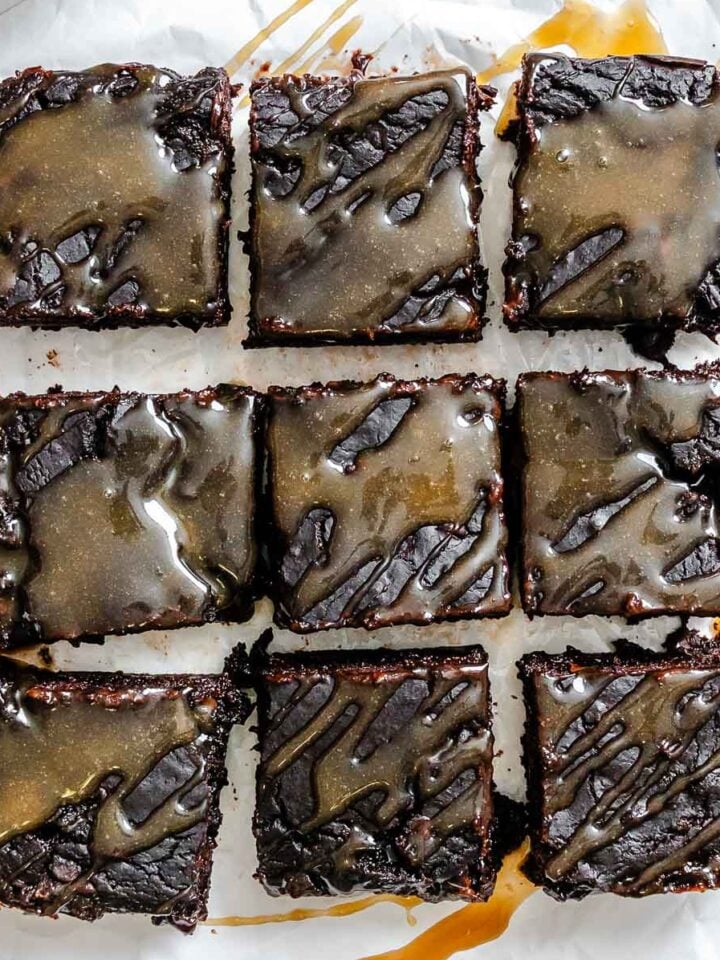 Completed Salted Caramel Brownies on a white surface.