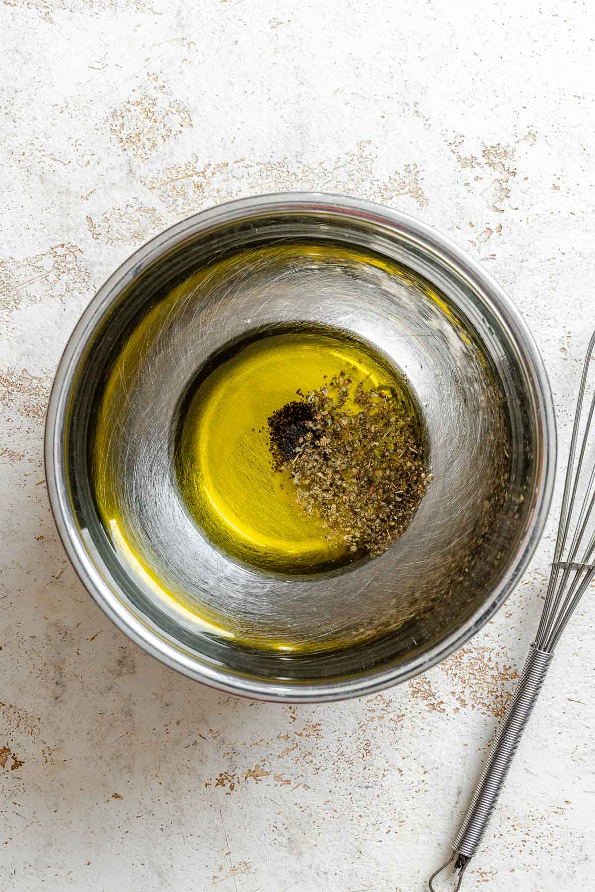 Process shot showing oil in a bowl.