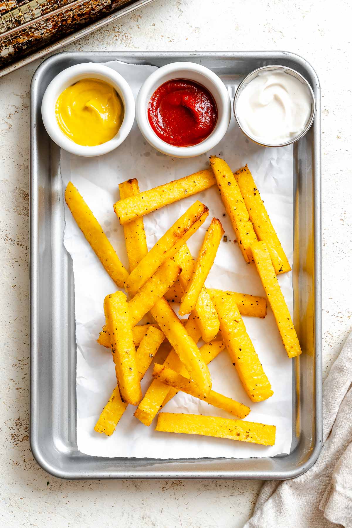 Completed Air Fryer Polenta Fries on tray.