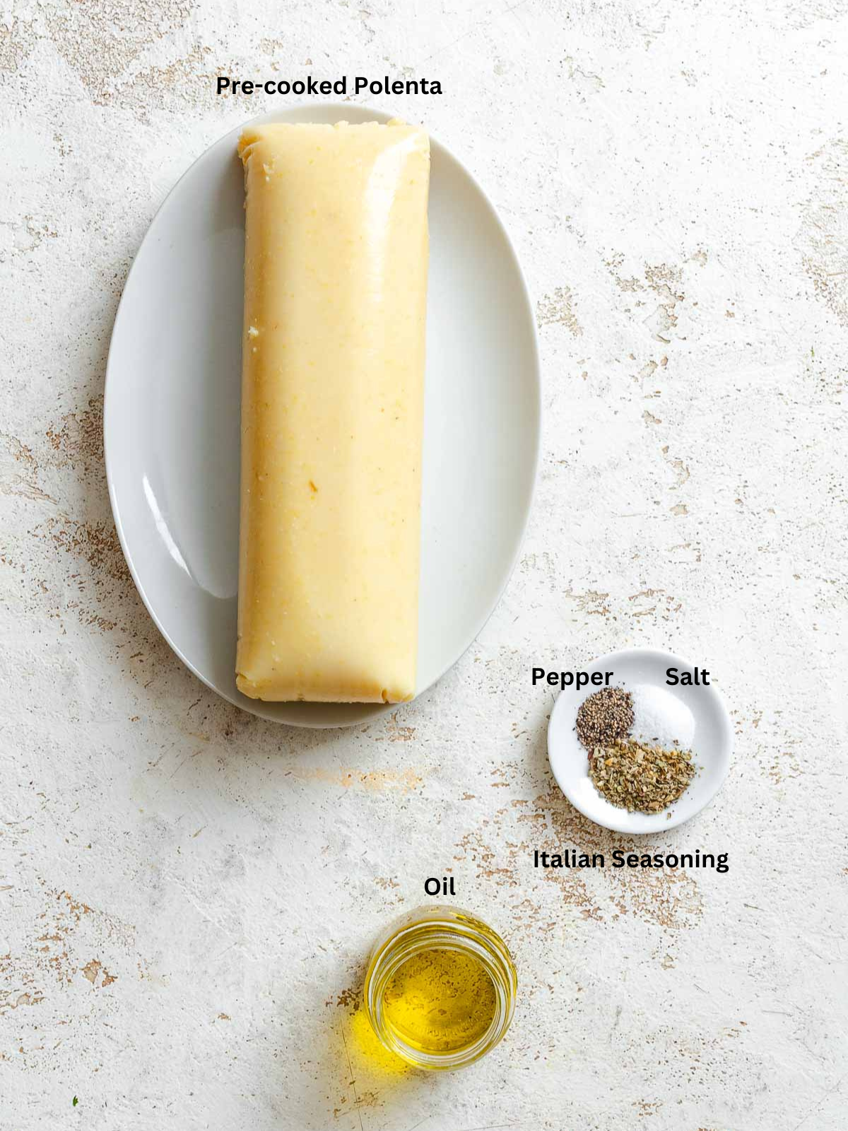 Ingredients for Air Fryer Polenta Fries measured out on a white surface.