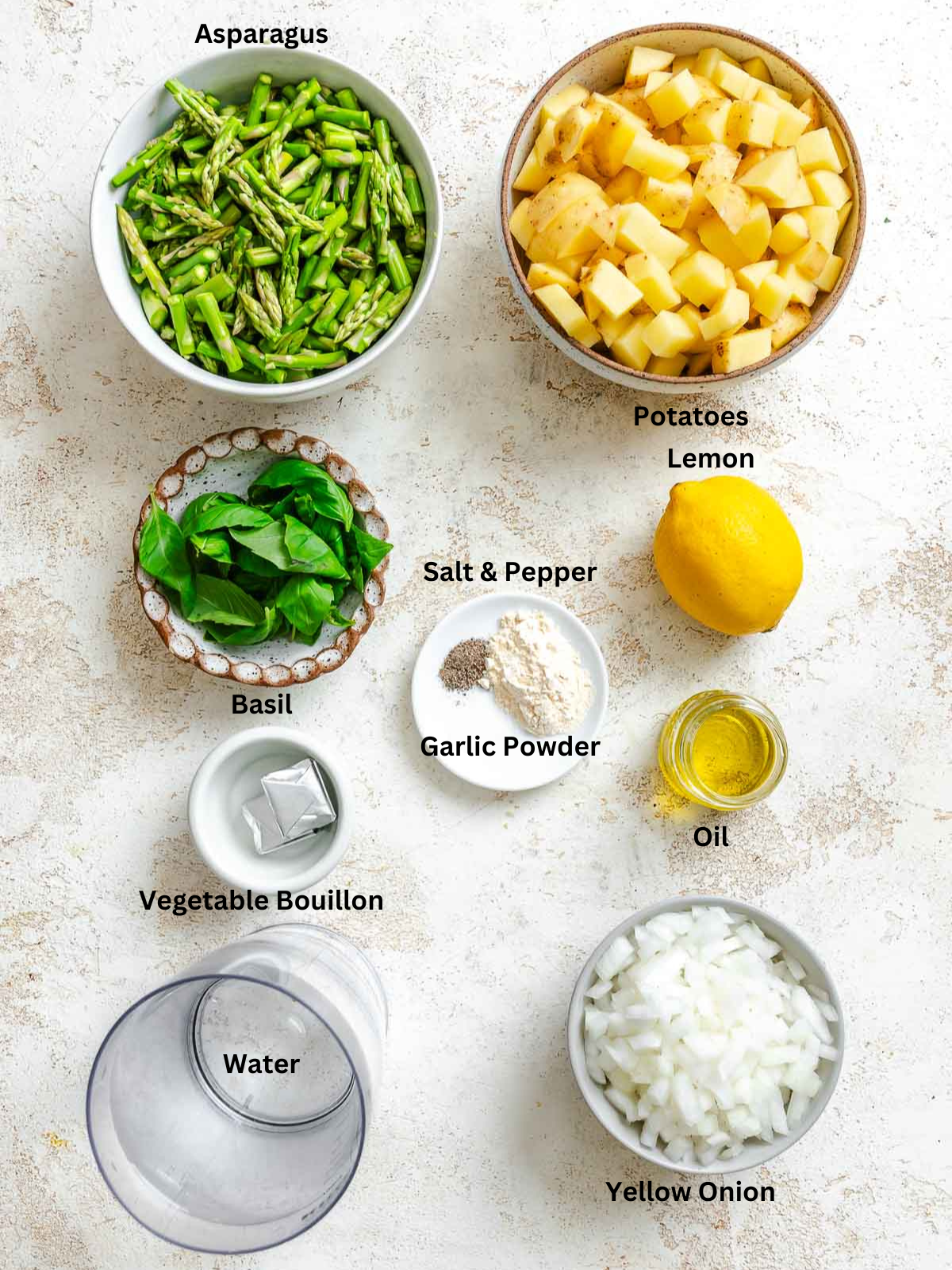 Ingredients for Potato Asparagus Soup measured out on a white surface.