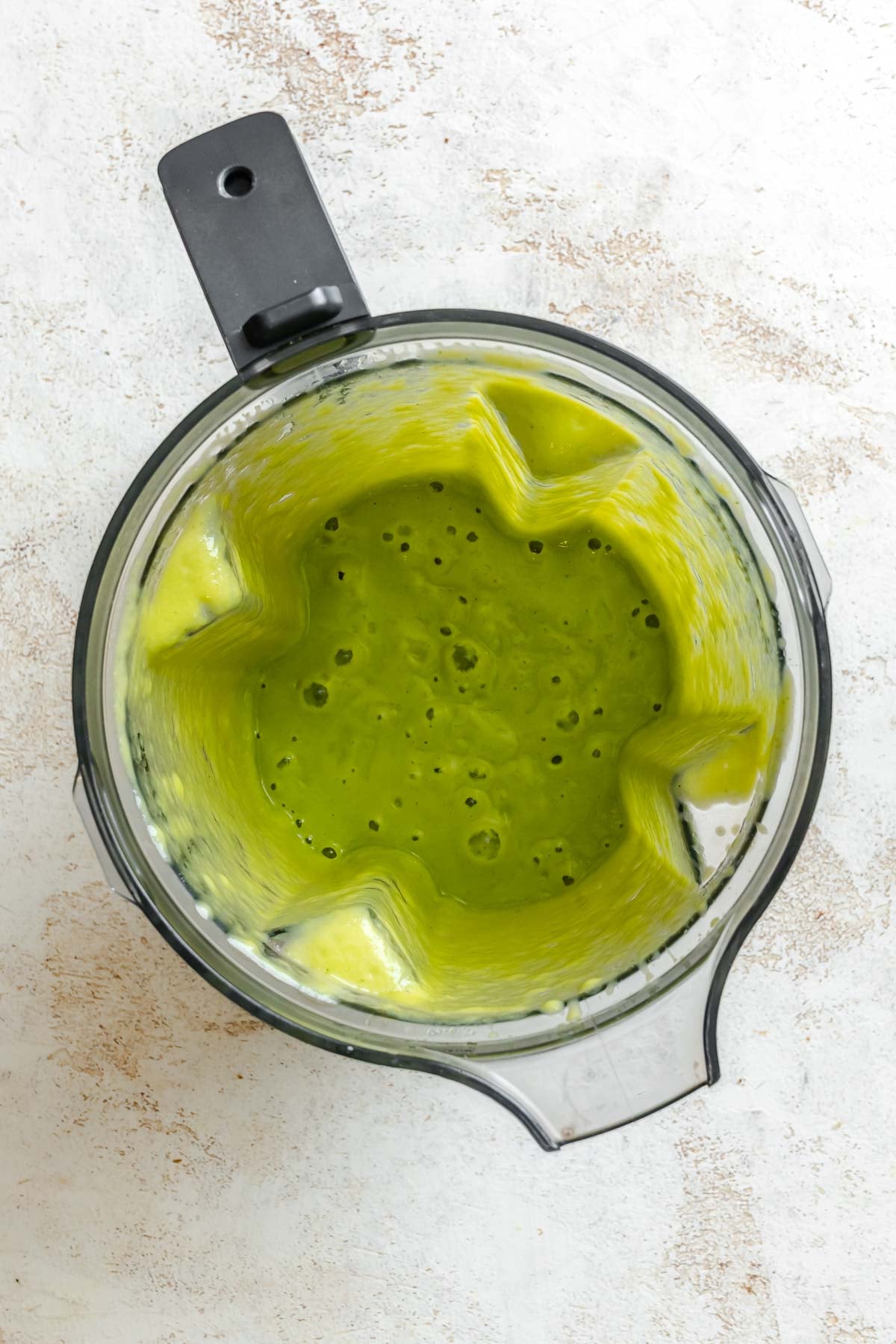 Process shot showing post blended ingredients in blender.