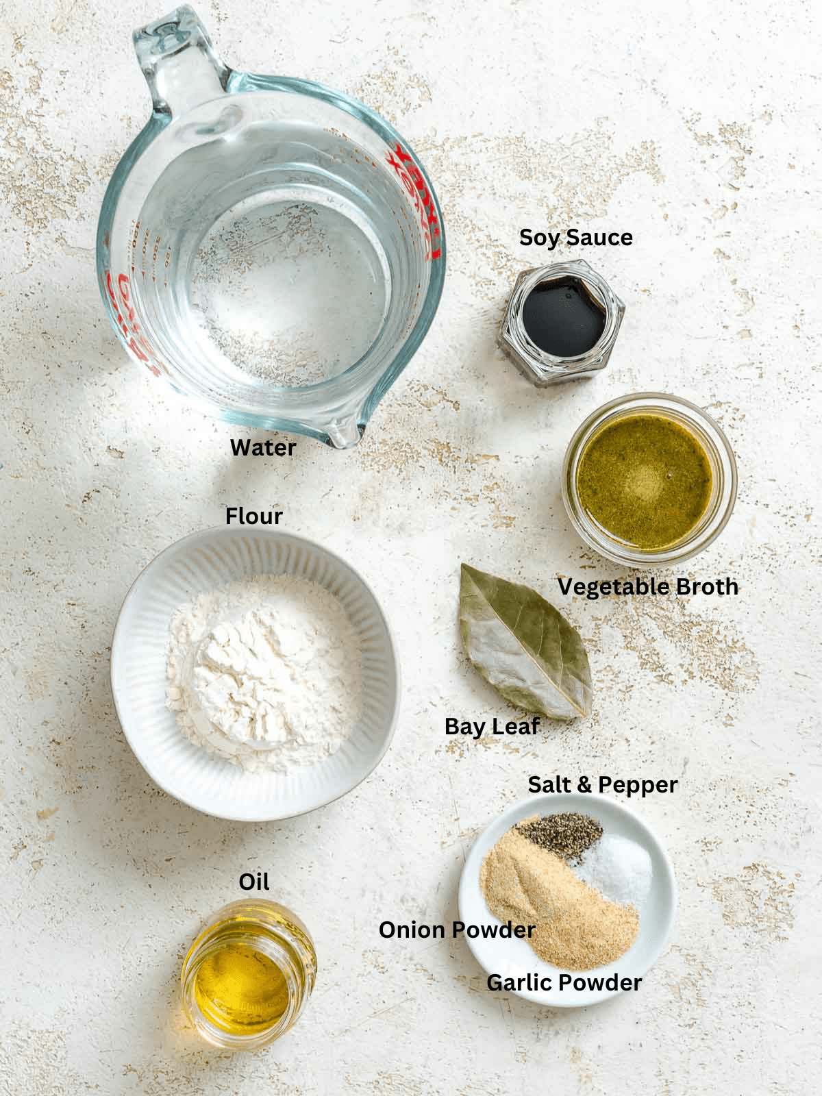 Ingredients for Easy Vegan Gravy measured out on a white surface. 