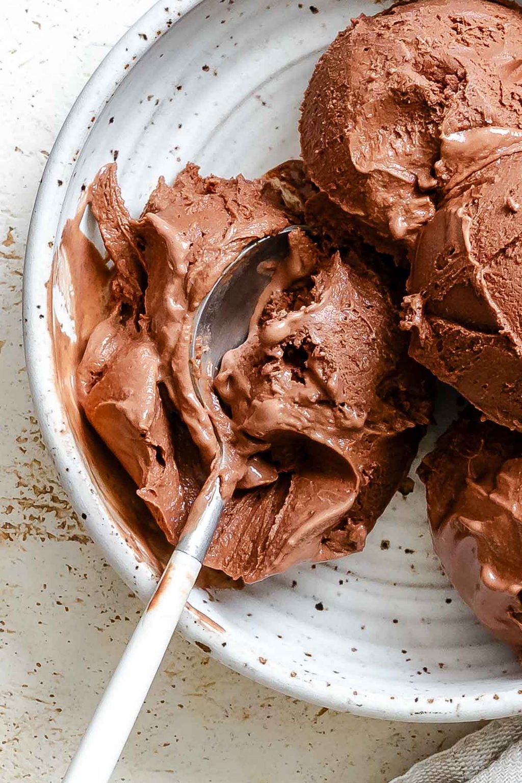 Completed scoops of Vegan Chocolate Ice Cream (Ninja Creami) in a bowl.