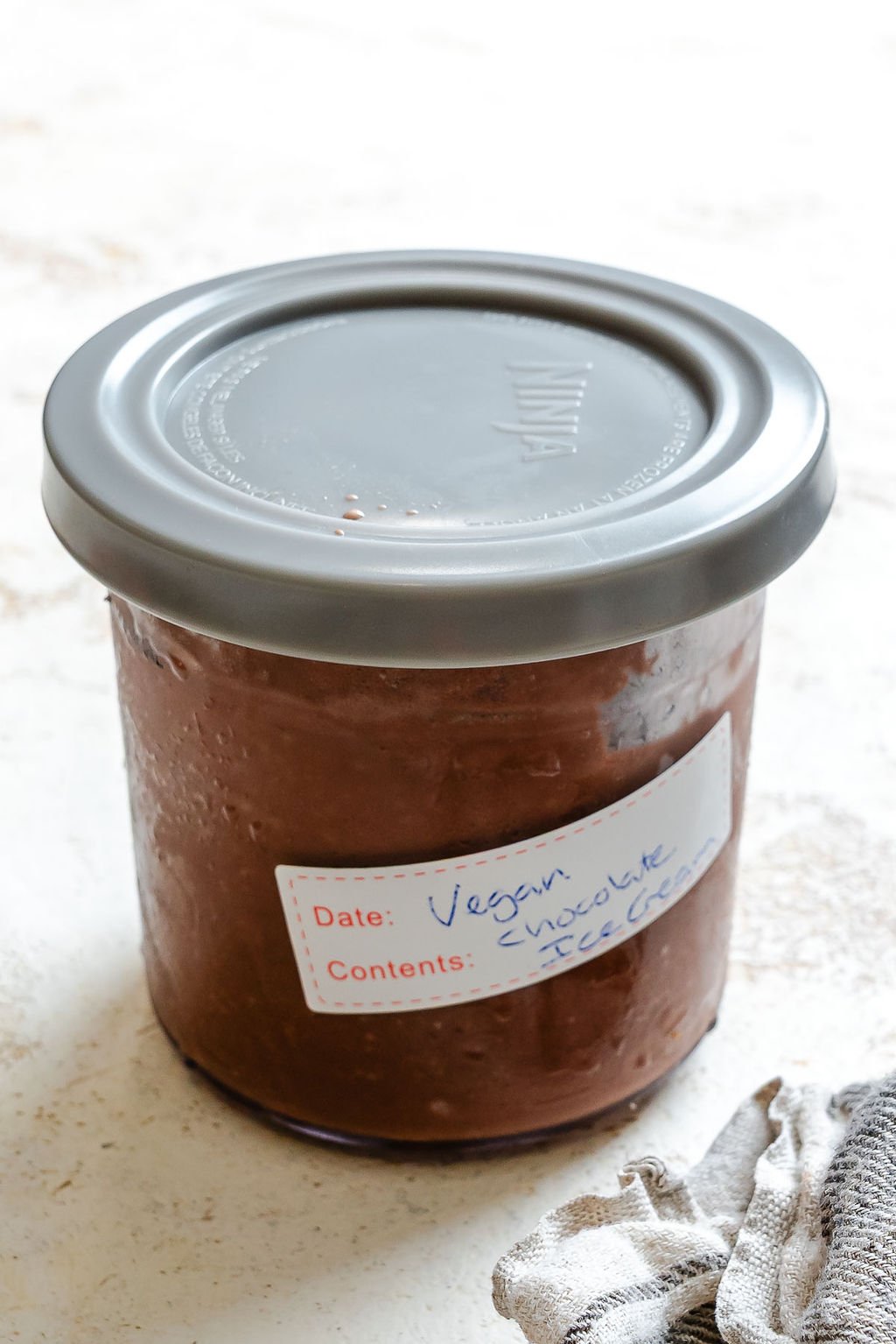 Completed Vegan Chocolate Ice Cream (Ninja Creami) in storage container.