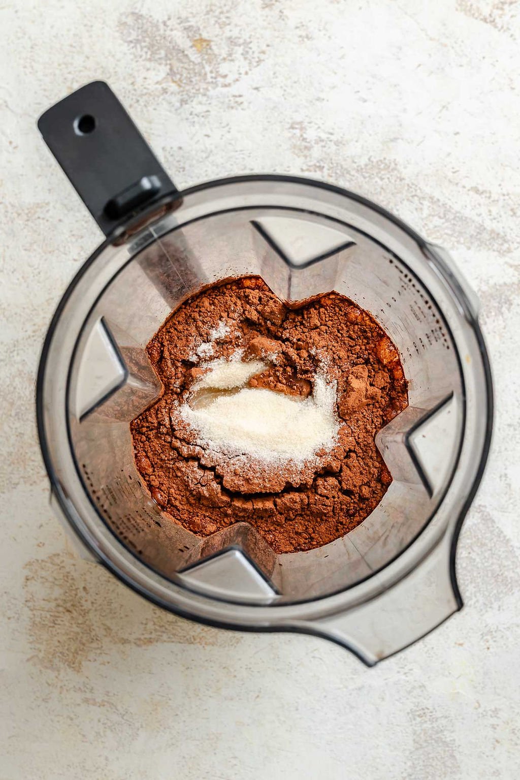 Process shot showing ingredients added to blender.