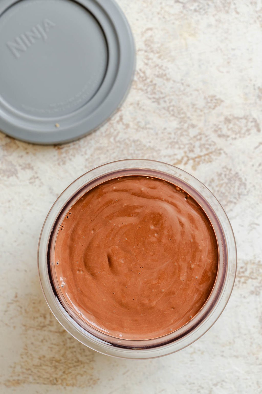 Process shot showing ingredients added to creami container.