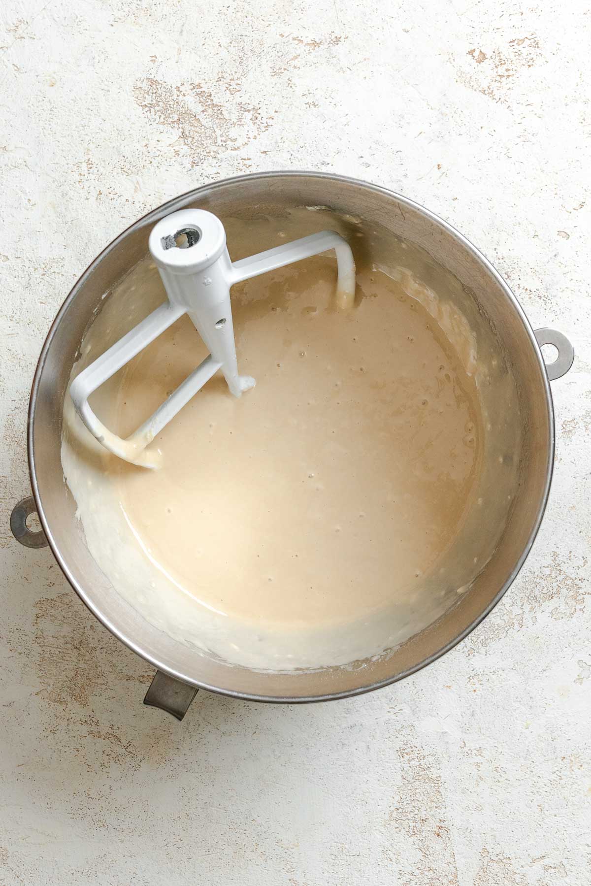 Process shot showing stirring ingredients in a bowl.