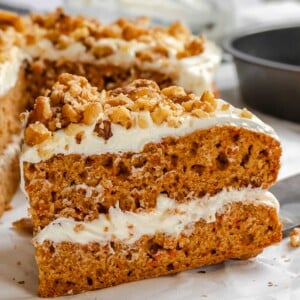 Completed Vegan Carrot Cake on white surface.