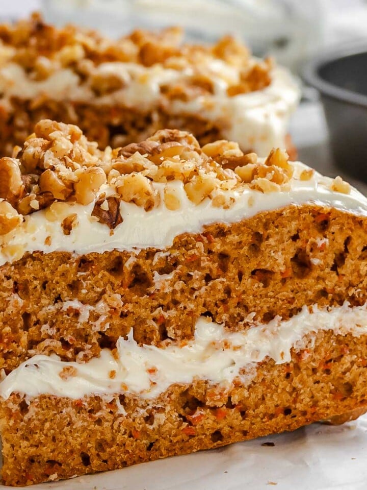 Completed Vegan Carrot Cake on white surface.