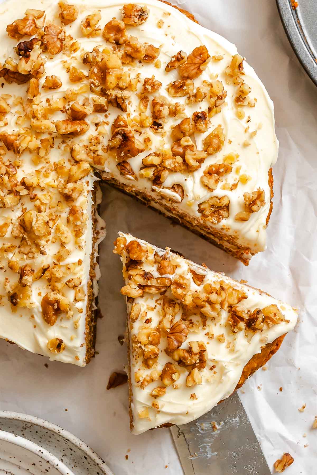 Completed Vegan Carrot Cake on white surface.