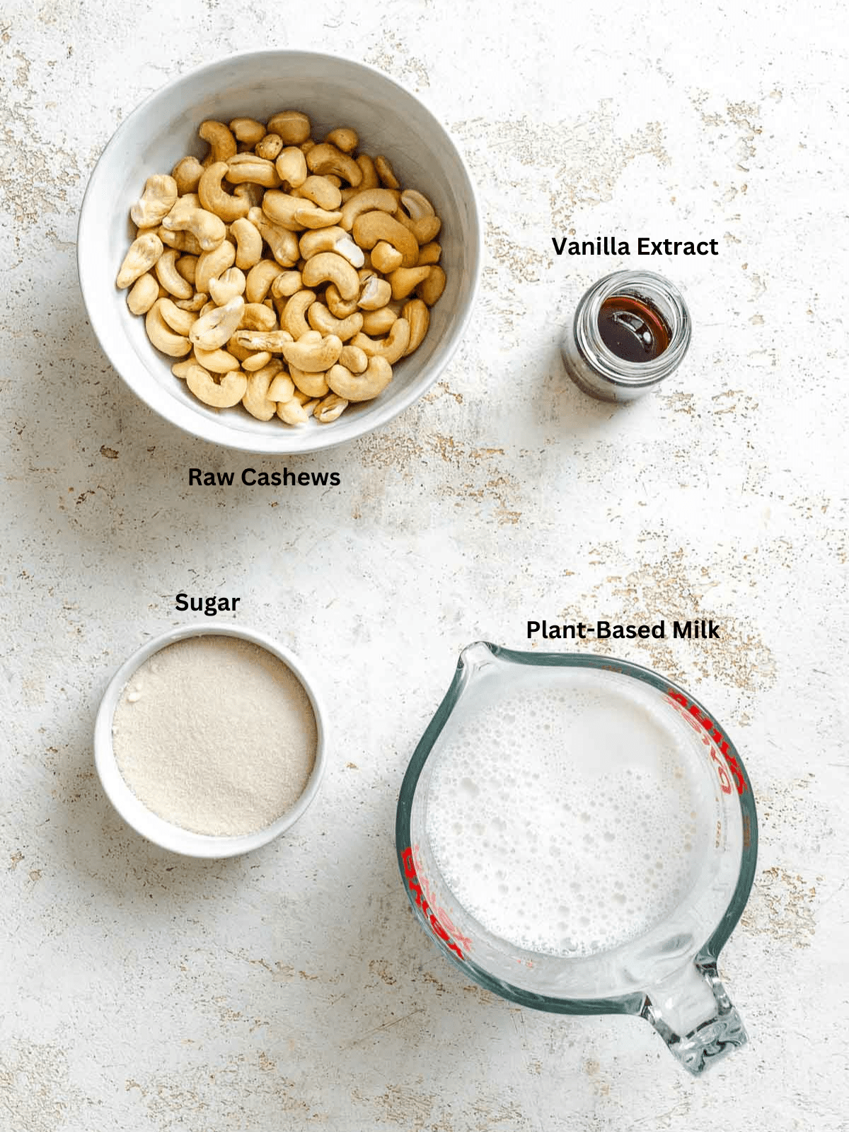 Ingredients for Vegan Vanilla Ice Cream (Ninja Creami) measured out on a white surface.