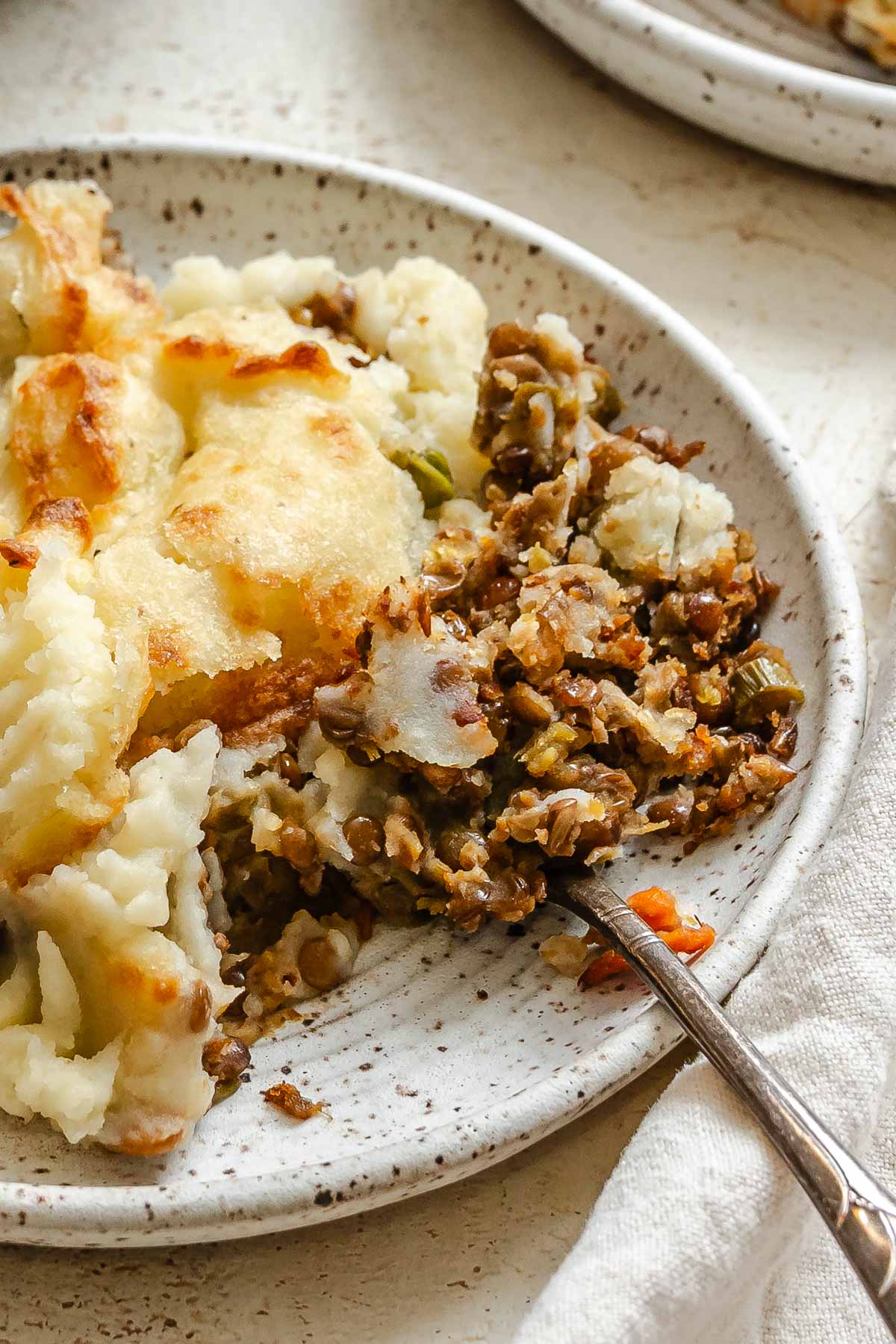 Completed Vegan Lentil Shepherd's Pie on a plate.