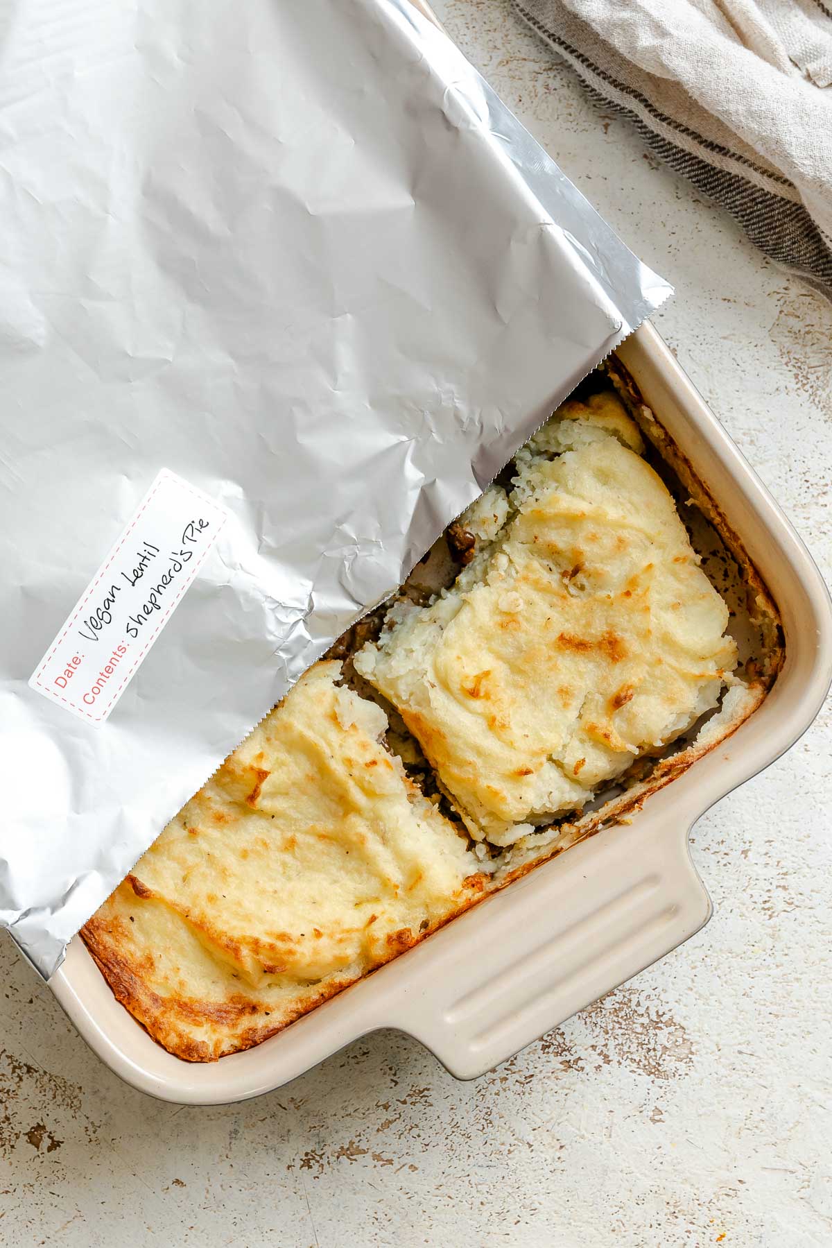 Completed Vegan Lentil Shepherd's Pie in a storage container.