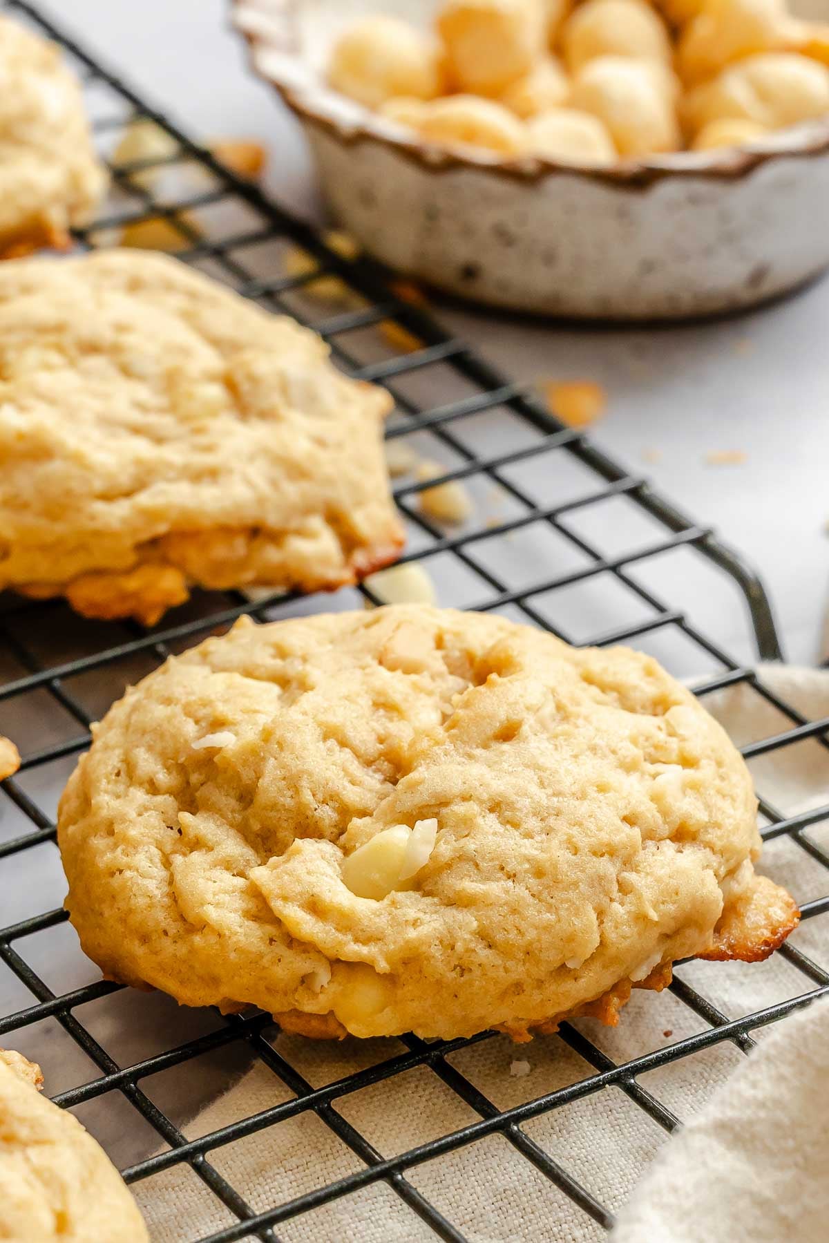 Completed White Chocolate Macadamia Nut Cookies on a wire rack.