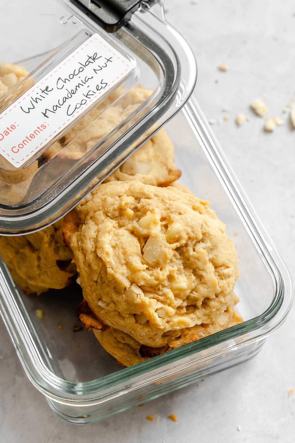 Completed White Chocolate Macadamia Nut Cookies in a storage container.