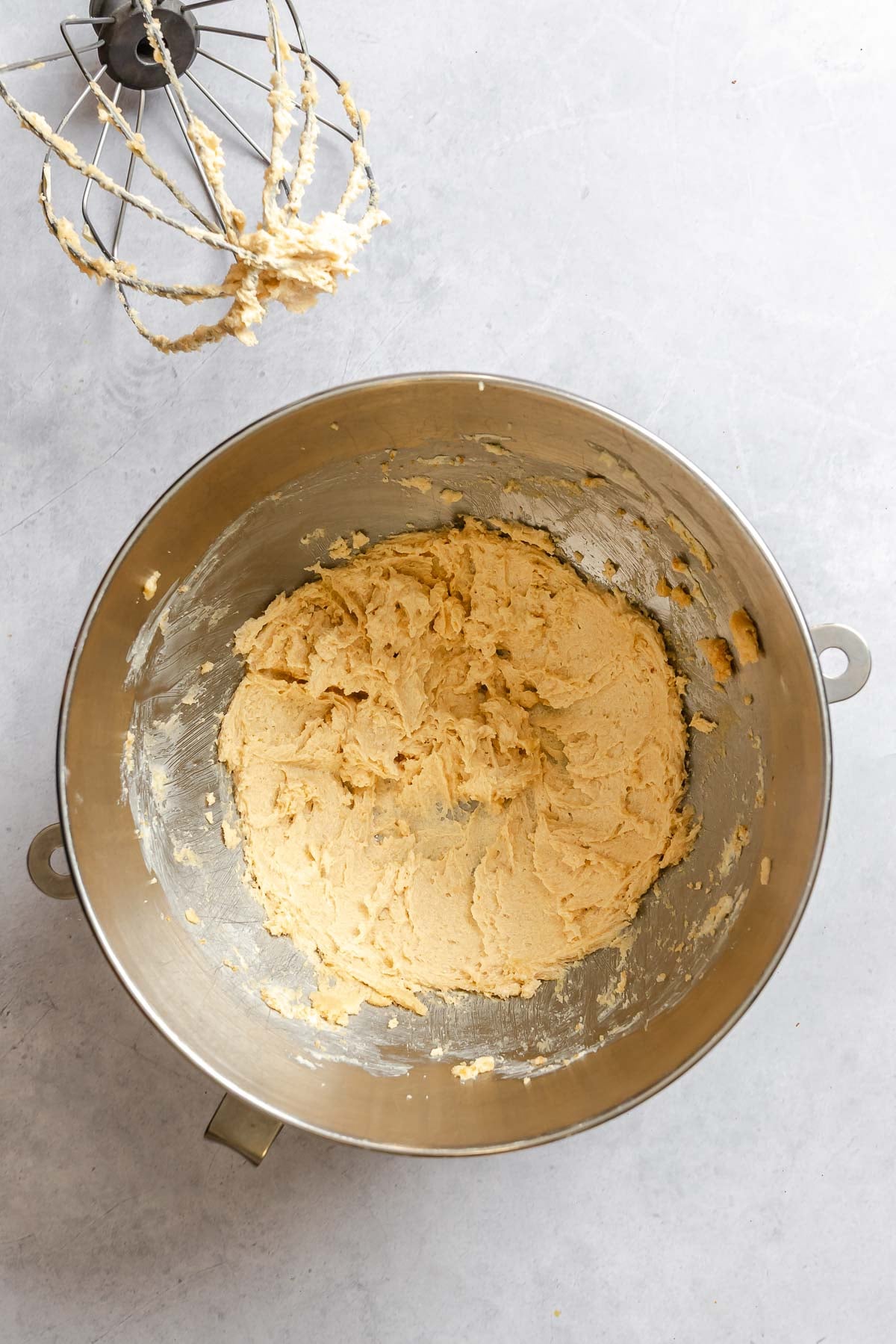 Process shot showing mixing ingredients together in a bowl.