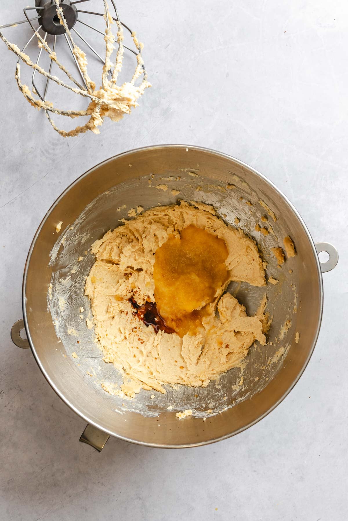 Process shot showing mixing ingredients together in a bowl.