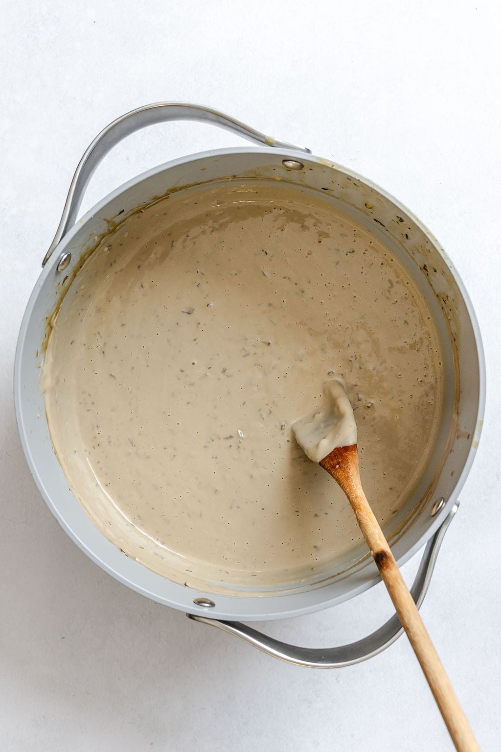 Process shot showing stirring ingredients in a bowl.