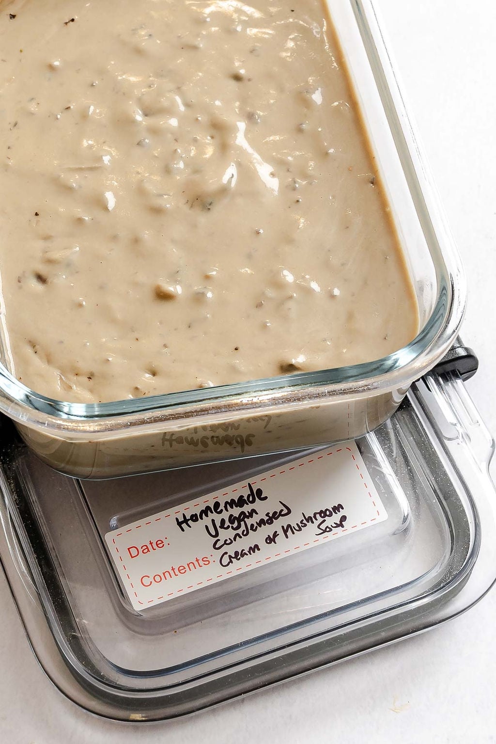 Completed Homemade Vegan Condensed Cream of Mushroom Soup in a storage container.